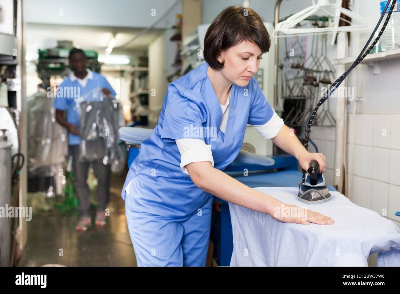Laundry worker hi-res stock photography and images - Alamy
