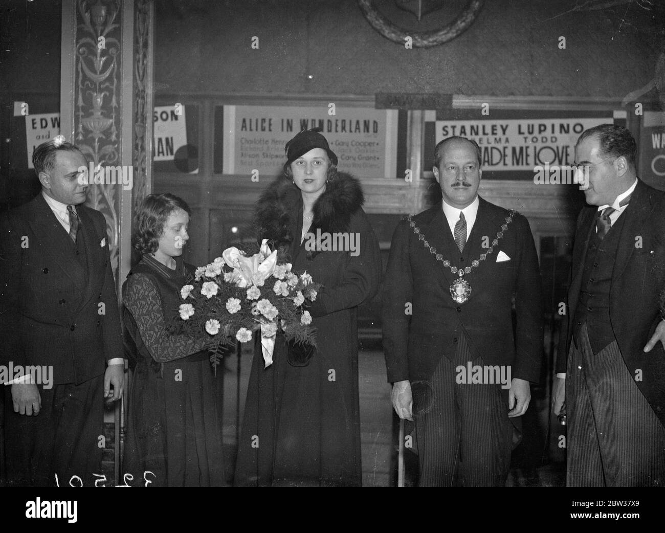 City of Westminster children at Christmas show . Several thousand children of the City of Westminster attended a special Christmas show at the Metropole Cinema , Victoria . Each child was given a parcel . Photo shows ; The Mayor of Westminster and the Mayoress , Councillor F Rudler and Mrs Rudler , with a bouquet of flowers presented from the children . 22 December 1933 Stock Photo
