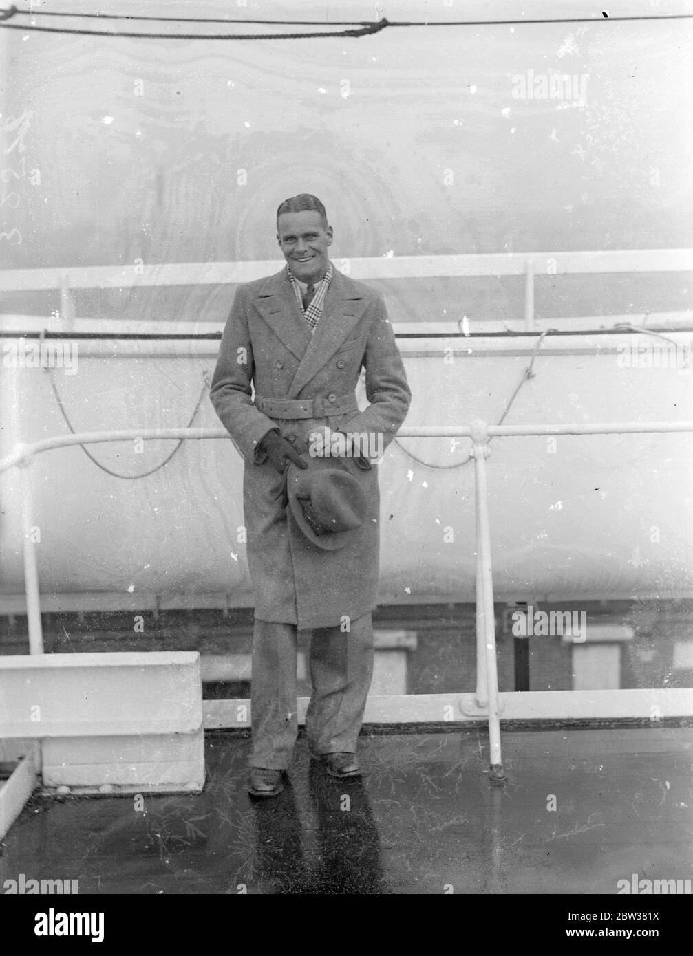 Huddersfield Town ' s , South African centre forward arrives . L S Brown , the Transvaal centre forward who has been signed on by Huddersfield Town FC , arrived at Southampton aboard the ' Dunbar Castle ' from Cape town . Brown is 23 years of age and is six feet two inches in height . He was welcomed on arrival by Mr Raymer , a Huddersfield Town director . Photo shows ; L S Brown on arrival at Southampton . 30 December 1933 Stock Photo