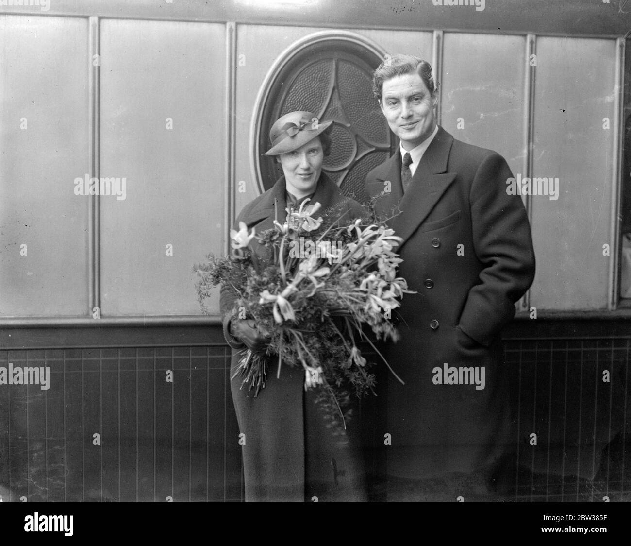 World famous woman ballet producer weds Viennese musician in London . Miss Margarete Wallman , one of the world ' s most famous ballet producers , was married at the Caxton Hall register office , London , to Mr Hugo Burghauser , a musician of the Vienna State Opera and president of the Vienna Philharmonic Orchestra . Miss Wallman is in charge of the ballet at Covent Garden this year . Photo shows the bride and groom . 5 May 1934 Stock Photo
