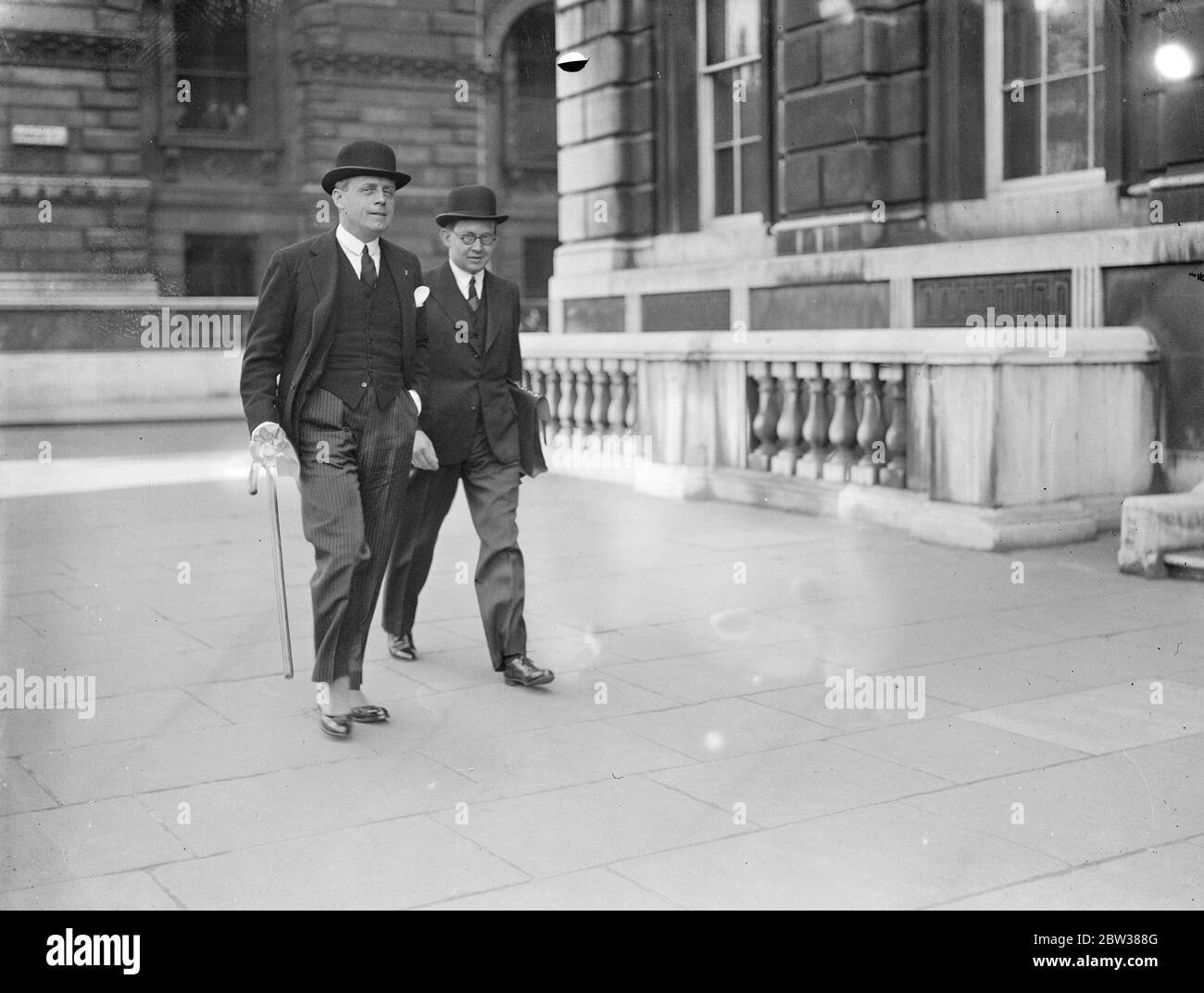 Hitler ' s envoy at the Foreign Office . Herr Joachim von Ribbentrop , hitler ' s personal envoy , visited the Foreign office in London to see Sir John Simon and try to discover whether there is any solution of the disarmament difficultes . Photo shows , Herr von Ribbentrop leaving the Foreign Office . 10 May 1934 Stock Photo