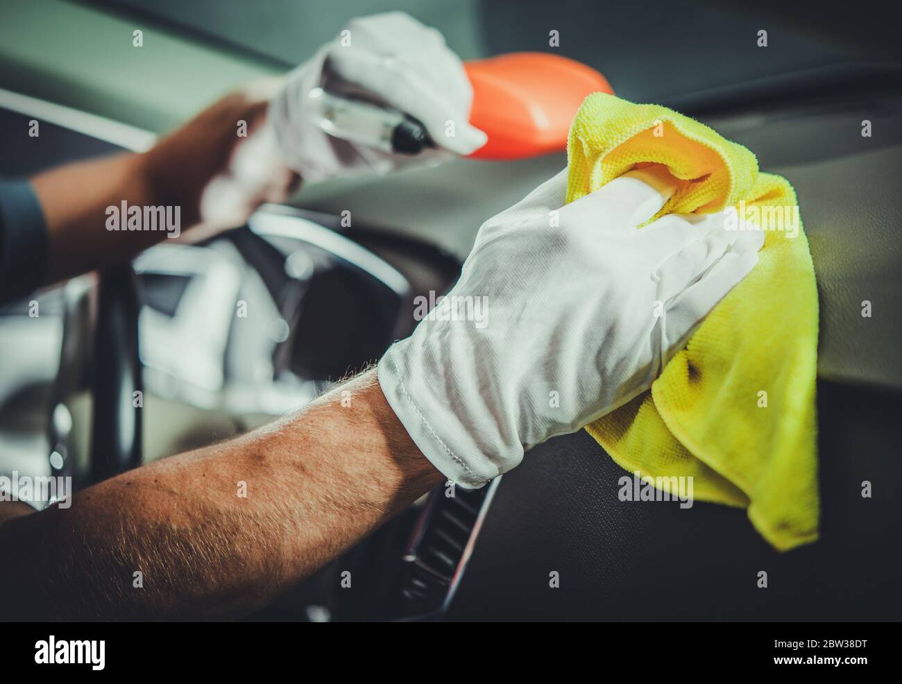 Caucasian Men Cleaning and Sanitizing Car Interior and Dashboard with