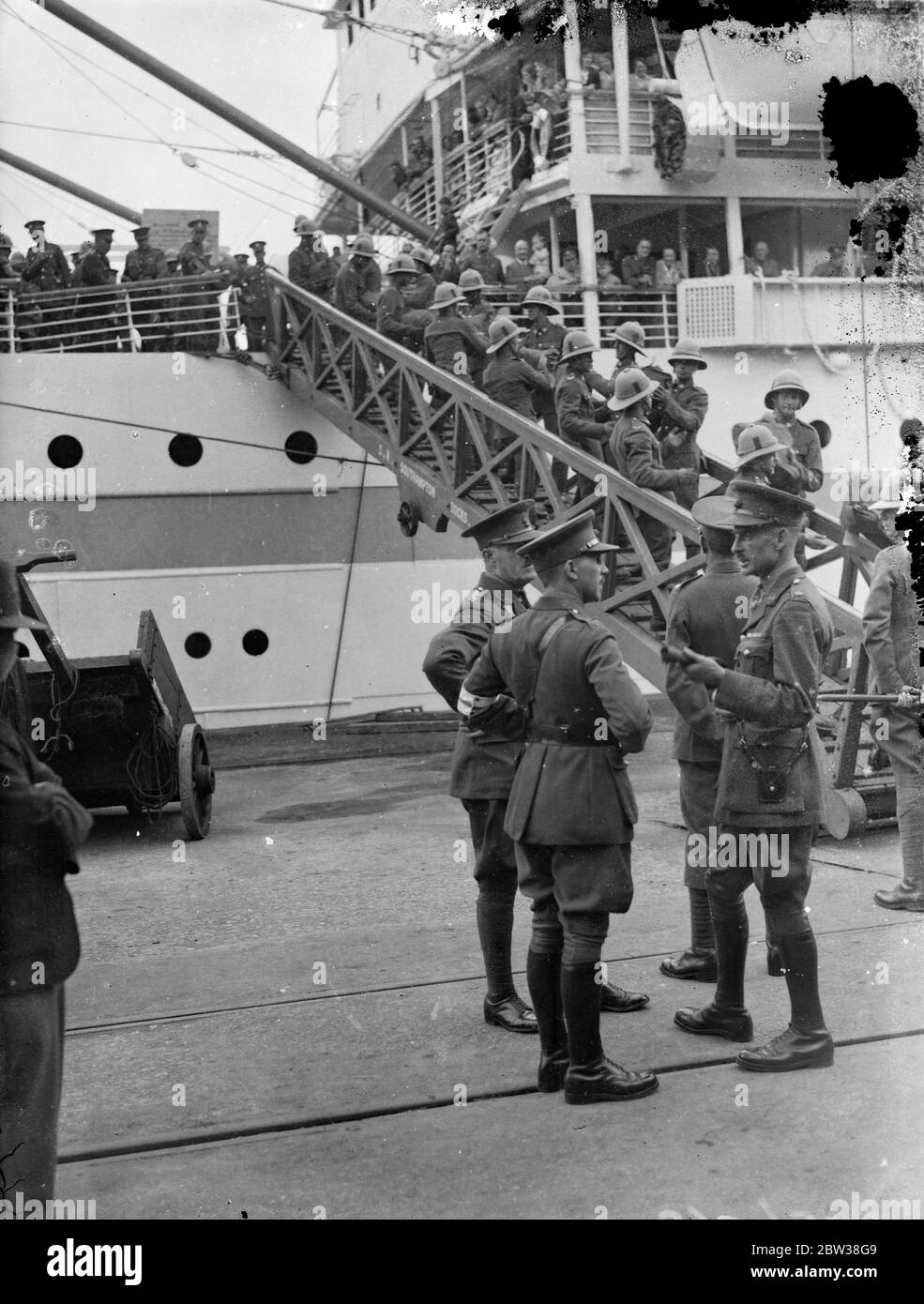 First troopship of the season . The first troopship of the season to leave Southampton was the SS Neuralia . She is taking a battalion of the Royal Berkshire regiment and other detachments to Bombay . Photo shows , troops going aboard the SS Neuralia at Southampton . 7 September 1934 Stock Photo
