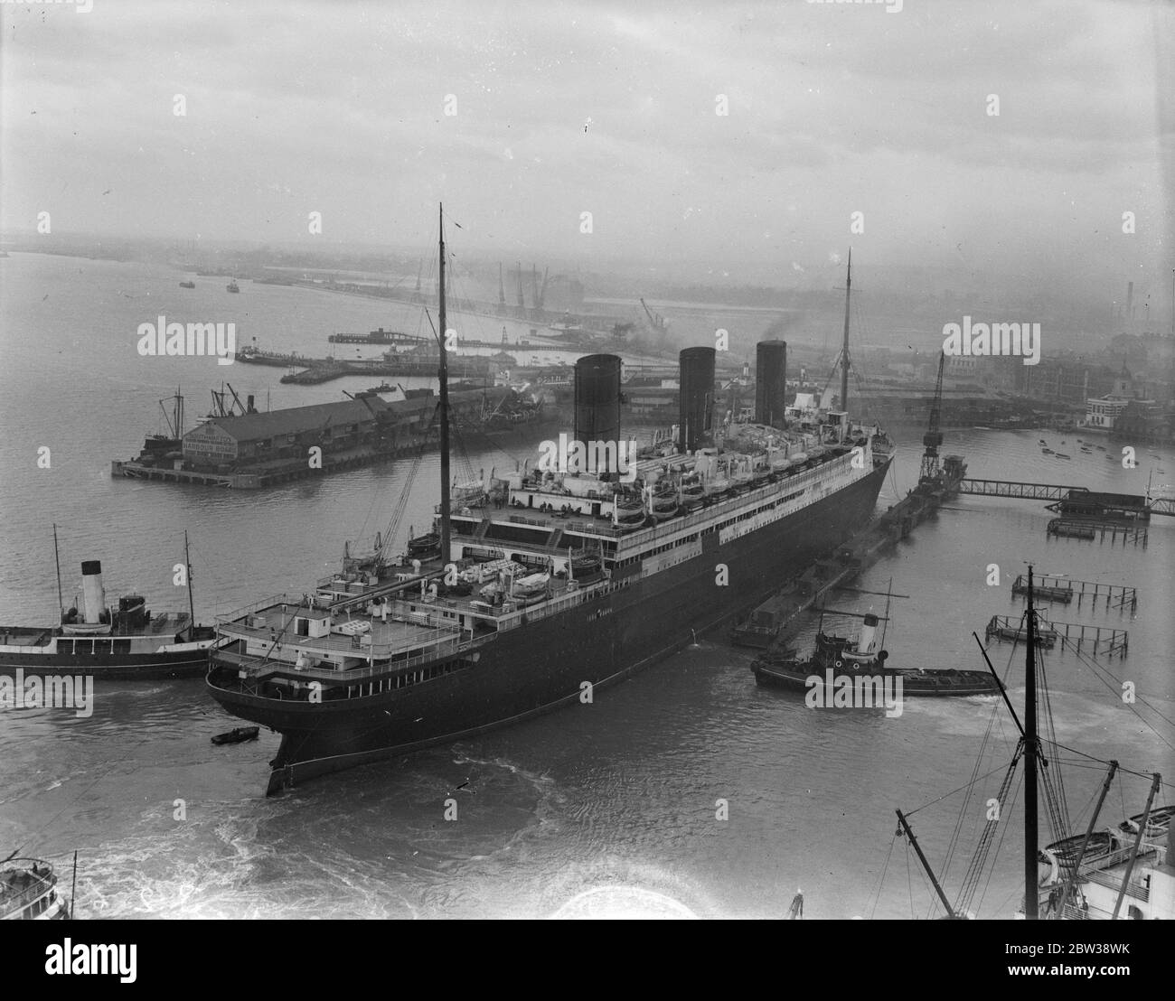 Berengaria  goes into floating dry dock for overhaul at Southampton . The cunard liner  Berengaria  was taken into the floating dry dock at Southampton for overhaul . Photo shows ; the  Berengaria  entering the floating dock at Southampton . 5 January 1934 30s, 30's, 1930s, 1930's, thirties, nineteen thirties Stock Photo