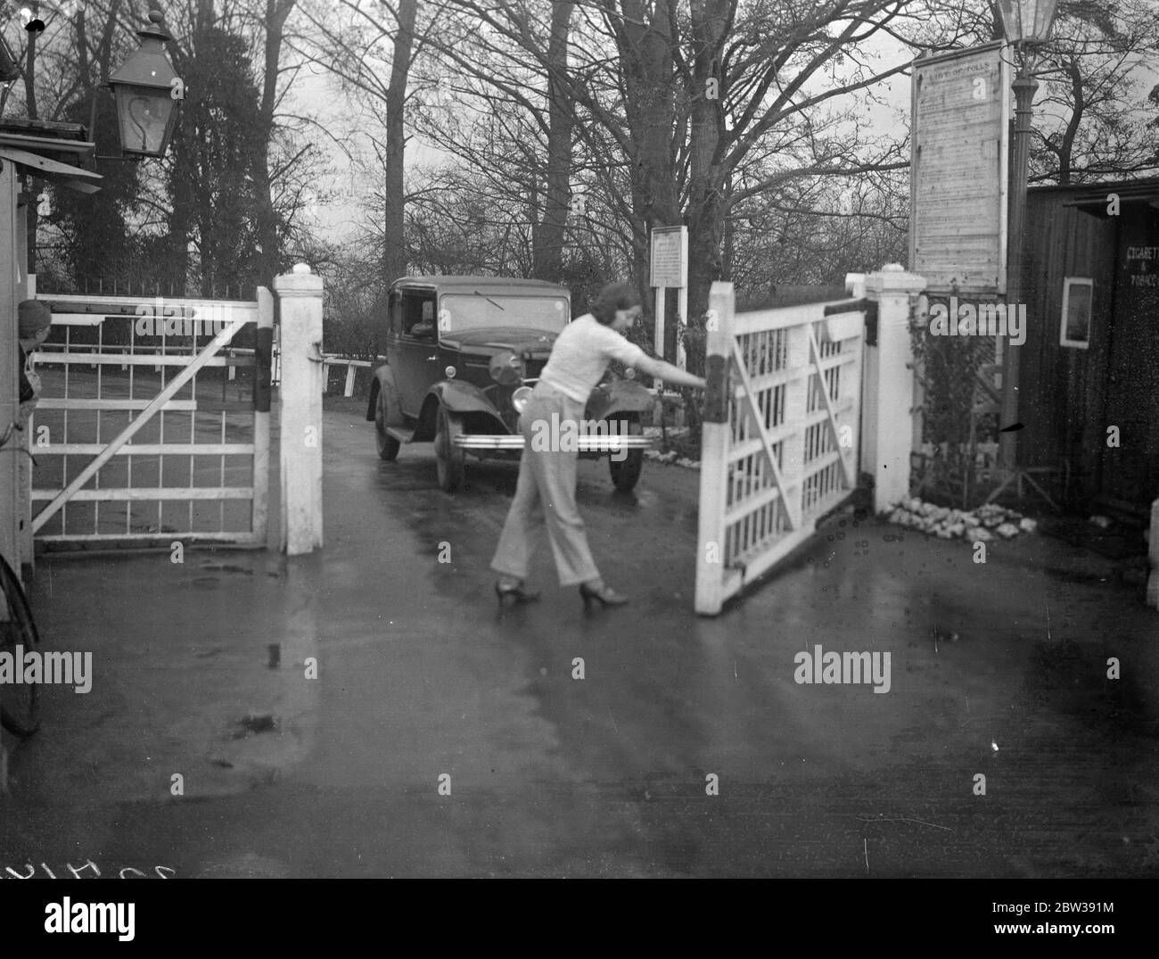 One of the few left . Toll gate kept by girl in trousers . One of the