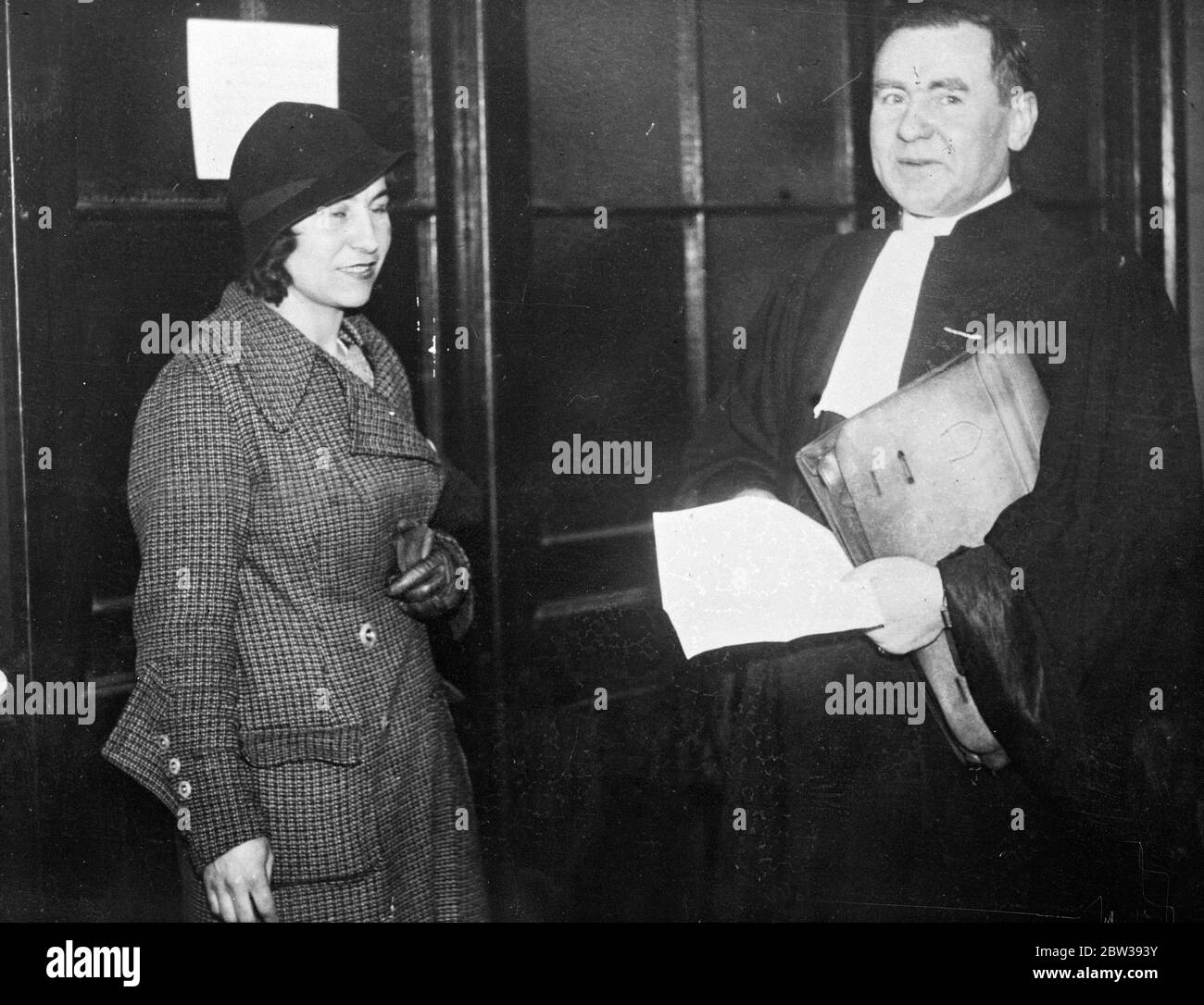 Woman identifies Jo Jo the terror , as the man who followed and murdered Stavisky judge . Mlle Taris , who declared that she had seen M Prince the murdered Stavisky judge , shadowed by a man at the Gare de Lyon , Paris , on the day he left for Dijon where he was killed , has now been identified as Georges Hainnaux ( Jo Jo the terror ) as the man . The police still have doubts however , as Mlle Taris had previously given a description of the man as being dark , whereas Hainnoux has white hair . Photo shows , Mlle Yvonne Taris leaving after having been confronted with Georges Hainnaux . 3 April Stock Photo