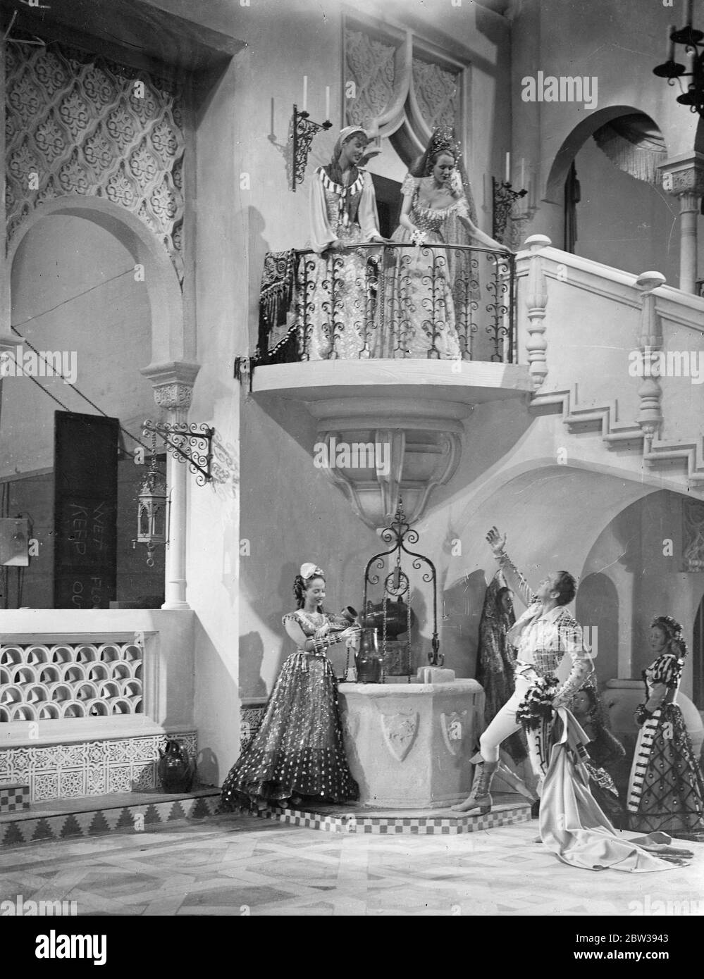 Douglas Fairbanks starts work on his new British film . Production of Douglas Fairbanks ' s new film ' The Private Life of Don Juan ' has been started at the Imperial Film Production ' s studios . Merle Oberon and Benita Hume are also in the cast . Photo shows , Douglas Fairbanks and Merle Oberon (below) with other ladies of the cast in one of the scenes . 5 April 1934 30s, 30's, 1930s, 1930's, thirties, nineteen thirties Stock Photo