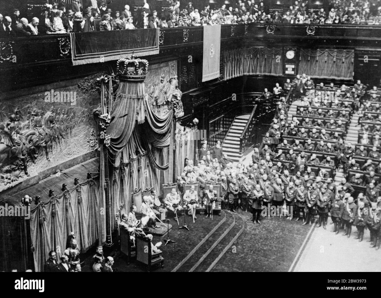 King and Mussolini open Italy ' s last parliament . Italy ' s armed forces must be efficient . The last of the Italian Parliaments was opened in Rome by King Victor Emmanuel and Signor Mussolini . In future legislative powers will be vested in the Fascist Grand Council . Signor Mussolini led the deputies in swearing allegiance to the King , but the customery phrase ' and to his royal successors ' was omitted . The King in his speech said that Italy desired peace and the great guarantee of this lay in the efficiency of Italy ' s armed forces . Photo shows ; the scene at the opening of the new P Stock Photo