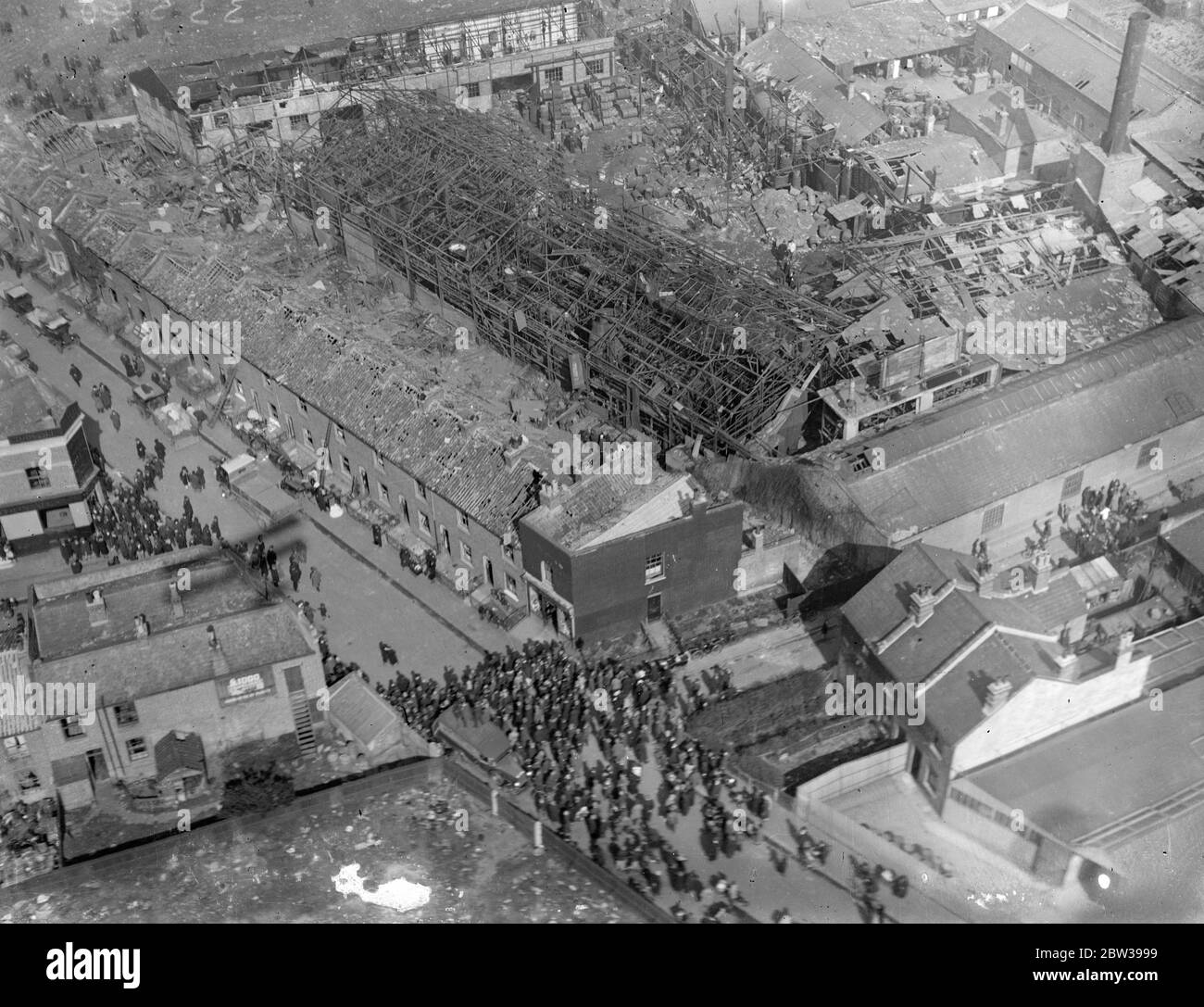 Death and devastation follows explosion at Mitcham chemical factory . A boy was killed and many were injured as the result of an explosion at the Bush Chemical Factory at Mitcham , London . The boy was Richard Addaway , aged about 10 , of Belgrave Road , Mitcham , where the houses were demolished by the explosion . 30 March 1933 30s, 30's, 1930s, 1930's, thirties, nineteen thirties Stock Photo