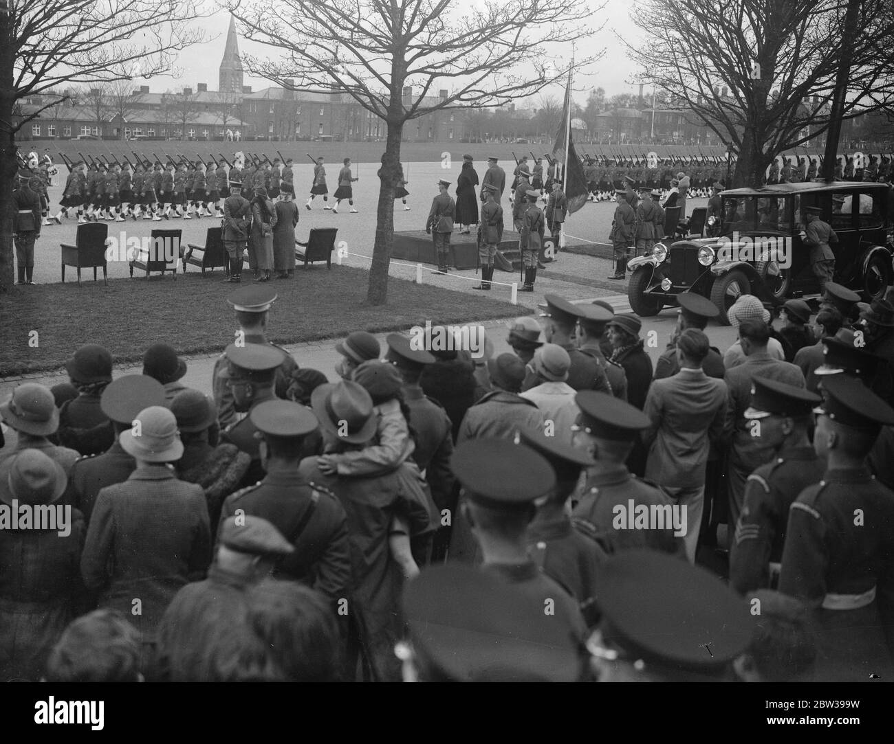 Taffy VI , mascot of the Welsh Regiment , leads the regiment in the march past when King and Queen reviews troops at Aldershot . Taffy VI , the well known mascot goat of the Welsh Regiment at Aldershot , led the regiment at the march past when the King and Queen reviewed the  Union Brigade  , on the Aldershot parade ground . Photo shows ; Taffy VI leading the Welsh Regiment past the King and Queen at the review . 19 April 1934 30s, 30's, 1930s, 1930's, thirties, nineteen thirties Stock Photo