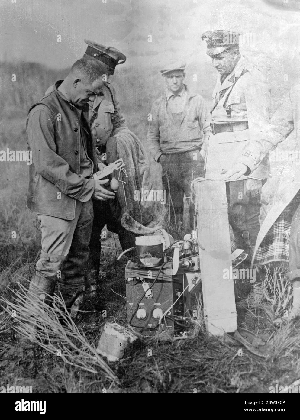 After their eleven miles ascent . American balloonists land at Bridgeton . Lieutenant Commander Settle of the United States Navy and Major Fordney ascended 58,000 feet into the stratosphere from Akron , Ohio . The balloon came to rest on the marshland southwest of Bridgeton , New Jersey . The aviators thus improved on the effort of Professor Piccard and Professor Max Cosyns , the pioneers of stratosphere exploration . Major Fordney ( left ) and Lieut Commander TGW Settle in front of their stratosphere balloon after landing near Bridgeton , New Jersey . 29 November 1933 30s, 30's, 1930s, 1930's Stock Photo