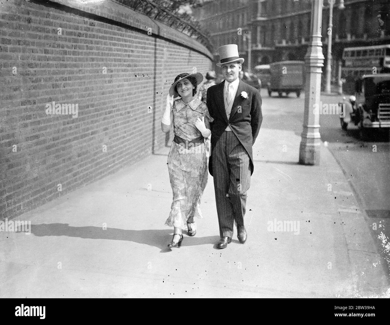 American woman lawyer at Royal Garden Party at Buckingham Palace . Miss Fanny Holtzman , the famous American woman lawyer , arriving with her brother , Mr David Marshall Holtzman , for the Garden Party . 25 July 1935 Stock Photo