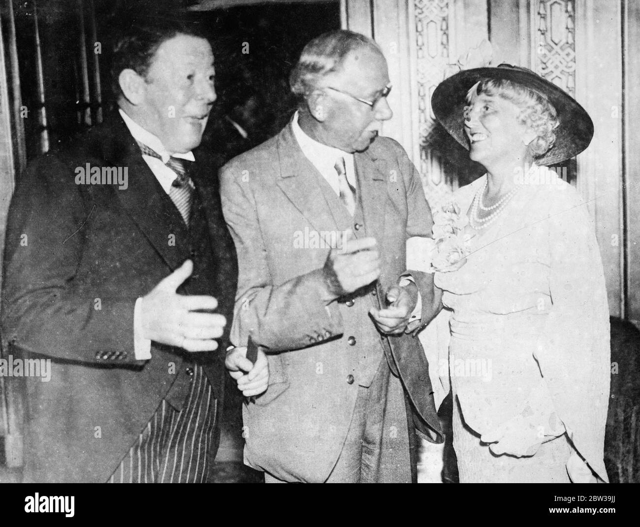 Sir Seymour Hicks entertained at luncheon to celebrate knighthood at Dorchester Hotel . Left to right - Sir Seymour Hicks laughing with J H Thomas , Dominions Secretary , and Lady Hicks at the luncheon . 25 July 1935 Stock Photo