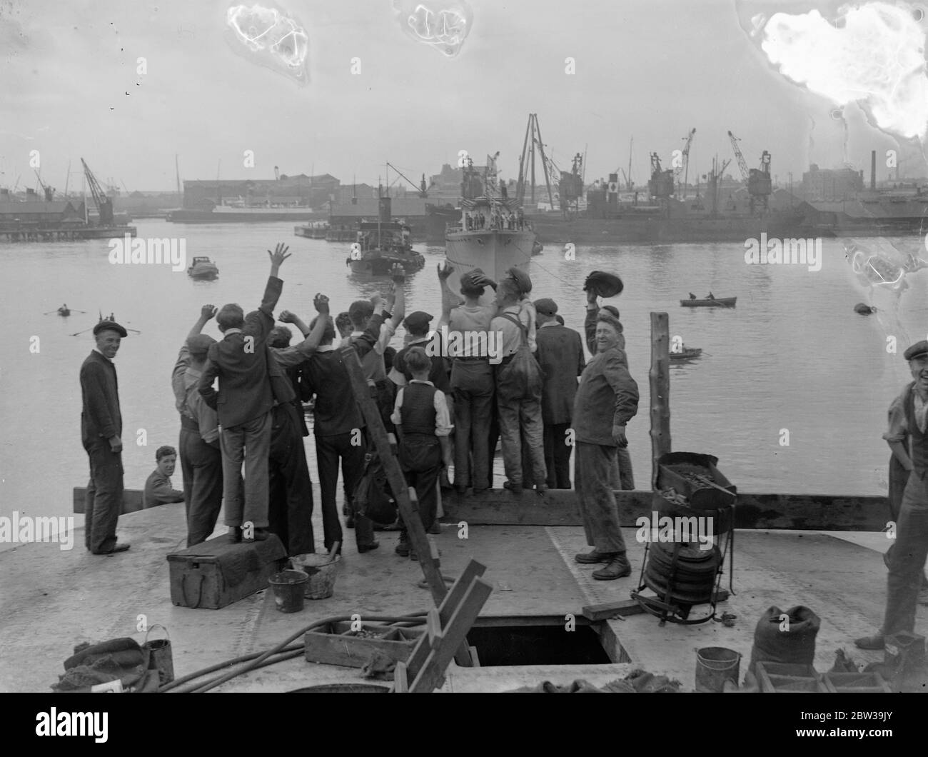 New HMS Grafton (H89) a G-class destroyer launched by Lady Barrie at Messrs Thorneycroft's yards at Woolston near Southampton . Photo shows workmen showing their delight at the completion of their work on HMS Grafton who sits proudly on her own lines infront of them . 22 July 1935 Stock Photo