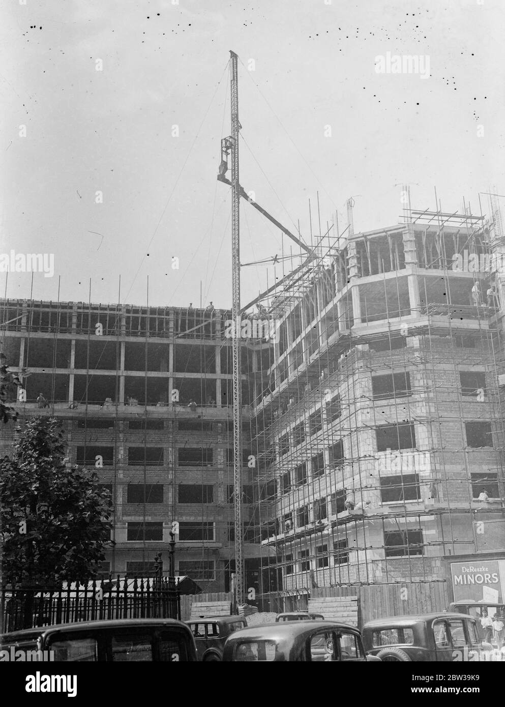 Europe 's largest block of flats will have bomb proof shelter at Albany Street and Euston Road . Pouring out the roof of the new flats . 25 July 1935 Stock Photo