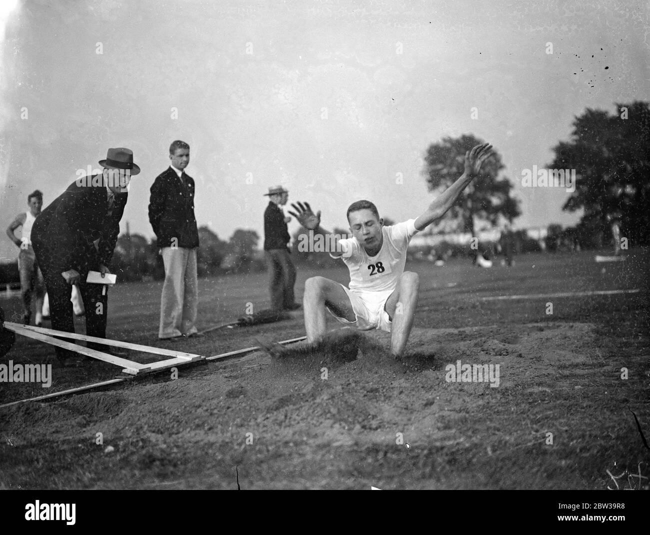 Paris schoolboy athletes meet London team for first time at Rutlish school , Merton , London . Photo shows , D E Redsull of Rutlish School , winning the long jump event . 26 July 1935 Stock Photo