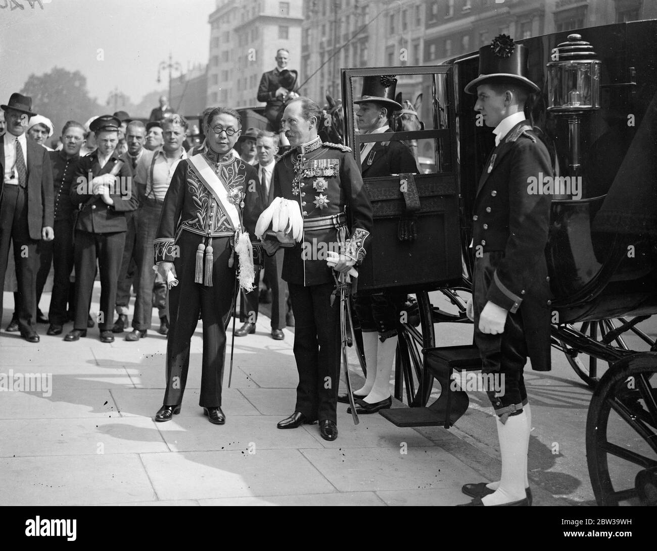 First Chinese Ambassador leaves the Chinese London embassy to present credentials to the King . Mr Quo Tai the new Chinese Ambassador , leaving with Sir Colin Clive for Buckingham Palace . 9 July 1935 Stock Photo