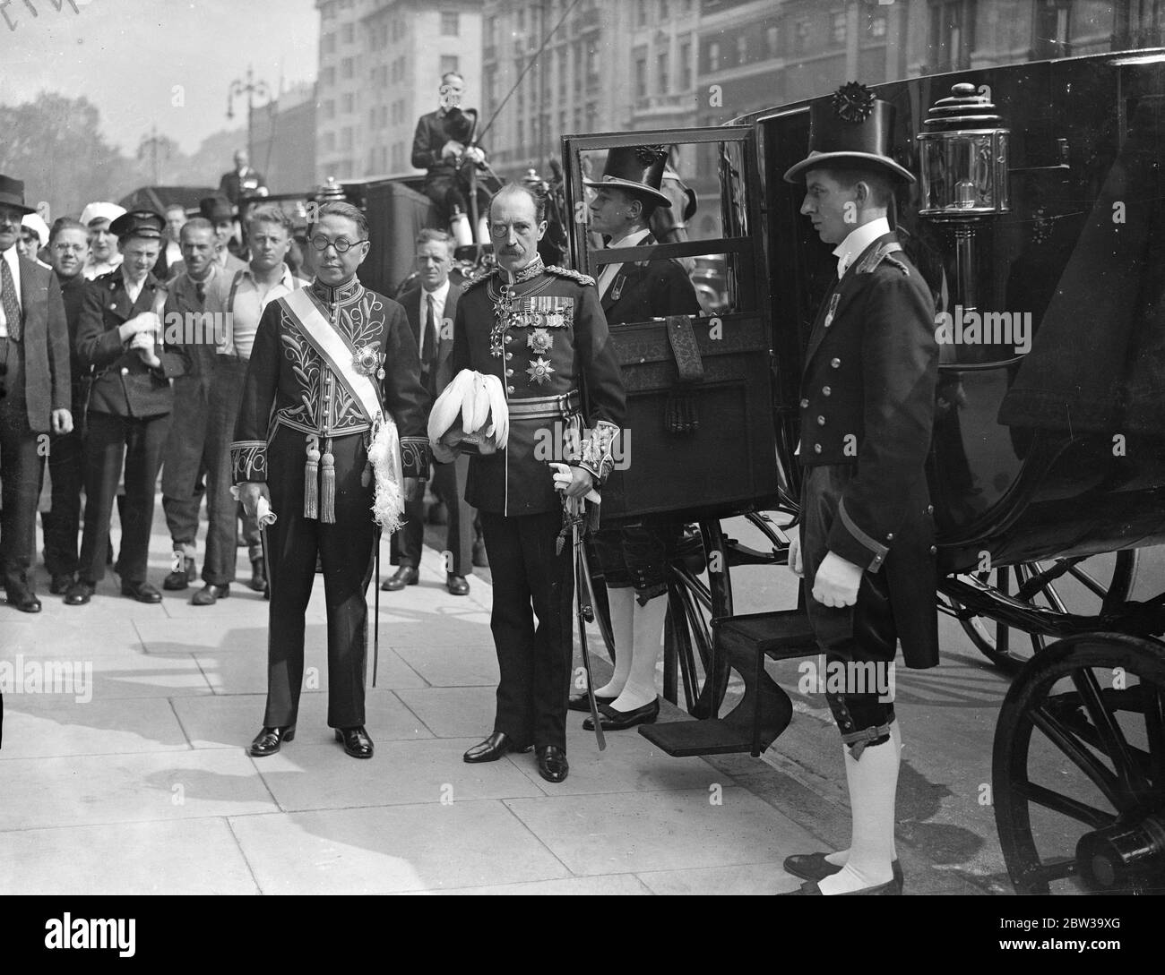 First Chinese Ambassador leaves the Chinese London embassy to present credentials to the King . Mr Quo Tai the new Chinese Ambassador , leaving with Sir Colin Clive for Buckingham Palace . 9 July 1935 Stock Photo