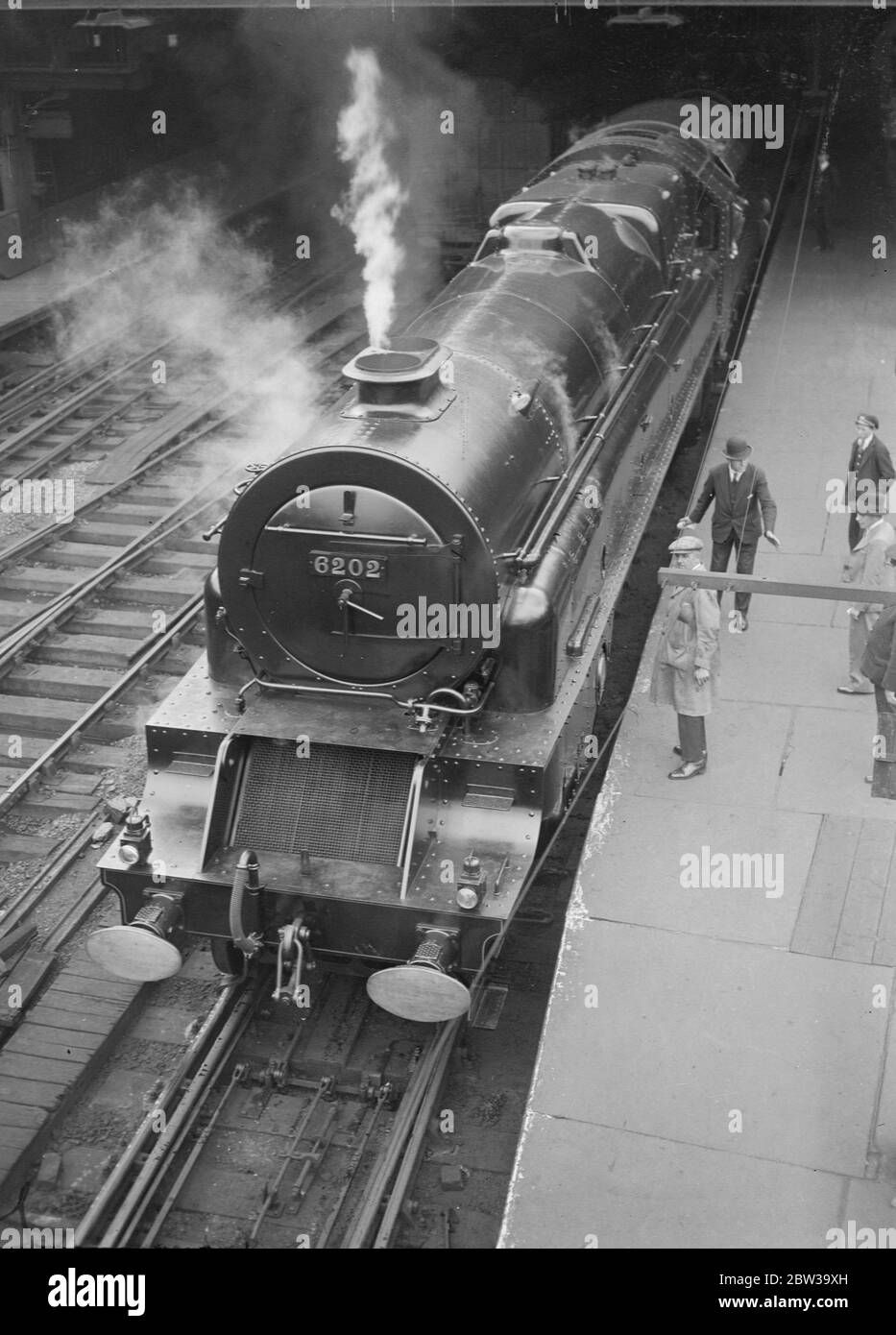 Britain 's first turbine driven locomotive on view at Euston . The  Turbomotive  at Euston . Note the  radiator  front and double funnel . 27 June 1935 Stock Photo