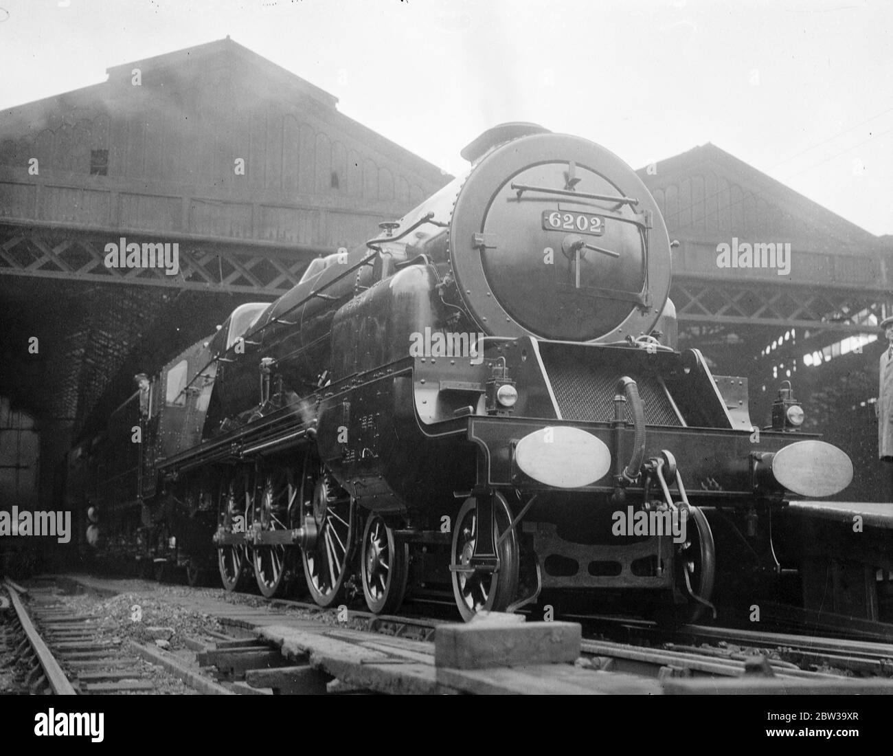 Britain 's first turbine driven locomotive on view at Euston . The  Turbomotive  at Euston . Note the  radiator  front and double funnel . 27 June 1935 Stock Photo