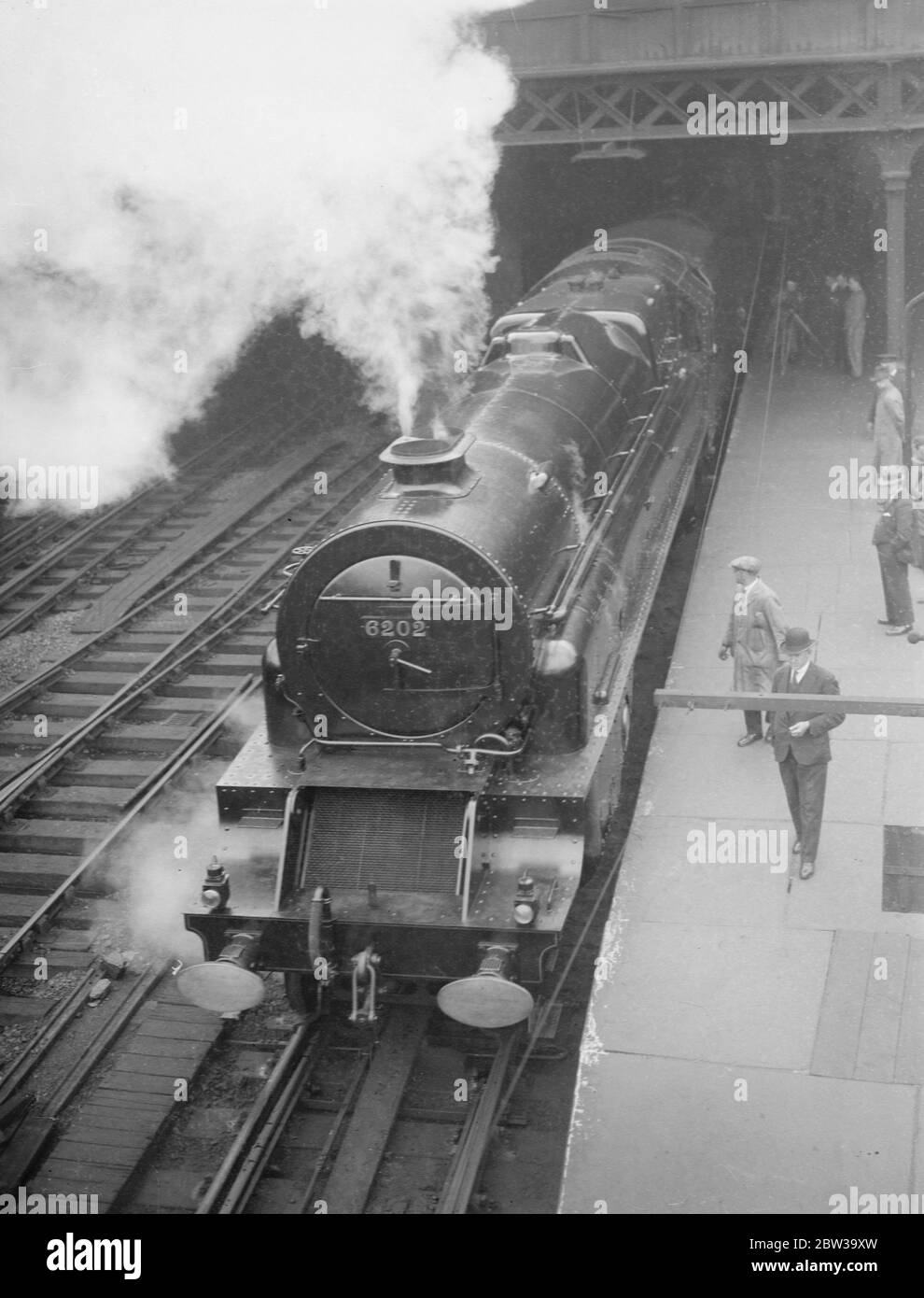 Britain 's first turbine driven locomotive on view at Euston . The  Turbomotive  at Euston . Note the  radiator  front and double funnel . 27 June 1935 Stock Photo