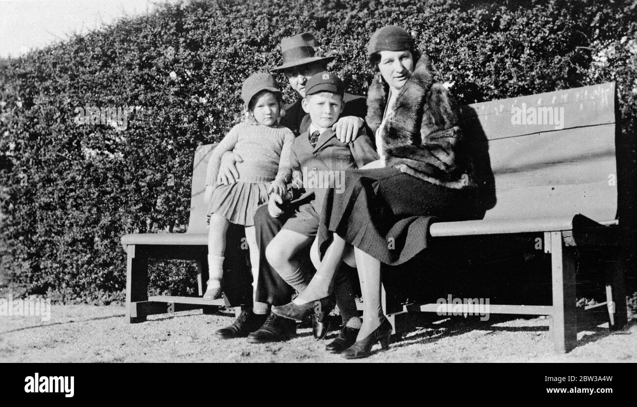 Australian test selector in England after working his passage . Dr Dolling is in England after having arrived at Hull on the Australian freighter Port Auckland . He worked his passage from Australia specially to see the test matches . Photo shows Dr Dolling with his wife and two children . 30 April 1934 Stock Photo