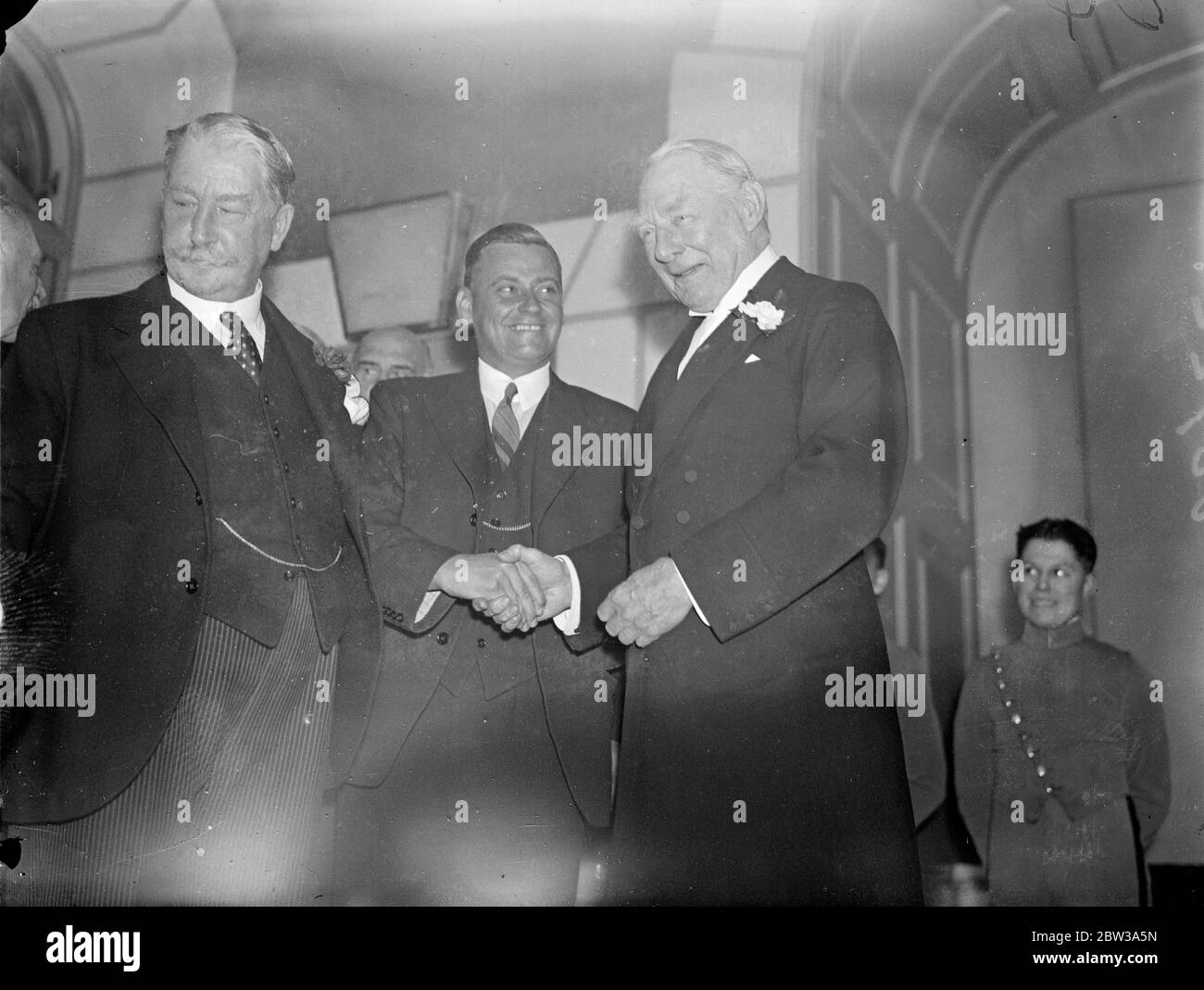 British sportsmen ' s luncheon to the Australian test team . Nearly 400 leaders in British sport were present at a luncheon presided over by Lord Lonsdale , at the Savoy Hotel London . Photo shows Lord Lonsdale greeting W M Woodfull , with Lord Decies the Chairman of the British Sportsman Club on the left . 30 April 1934 Stock Photo