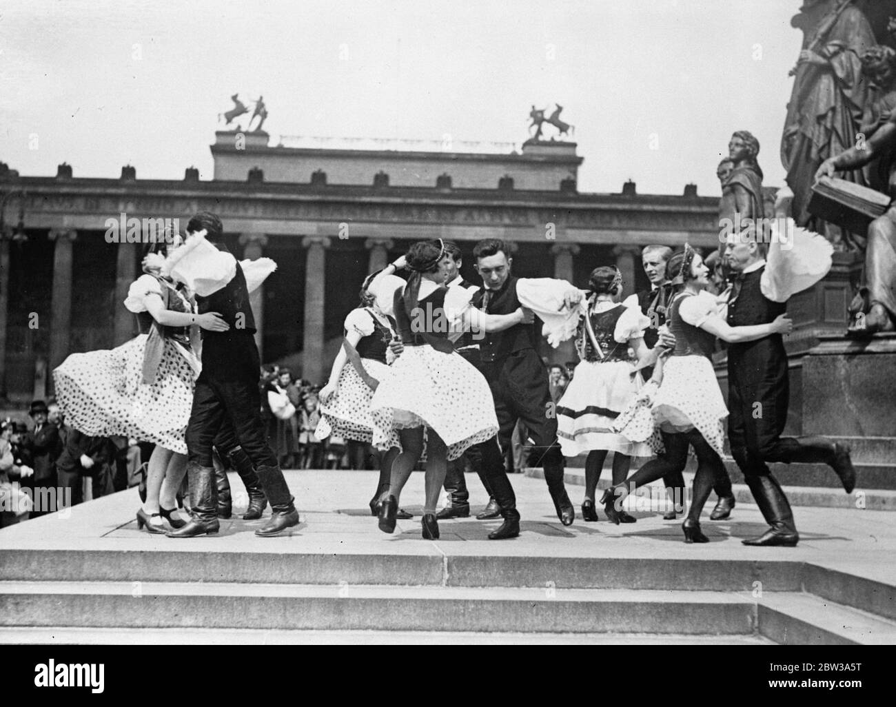 Hungarian folk dancers in the heart of Berlin . Berliners were provided with an unusual spectacle when , clad in peasant costume , a party of Hungarians performed national dances in the famous Lustgarten . The Hungarian dancers performing a Czardas in the Lustgarten . 30 April 1934 Stock Photo
