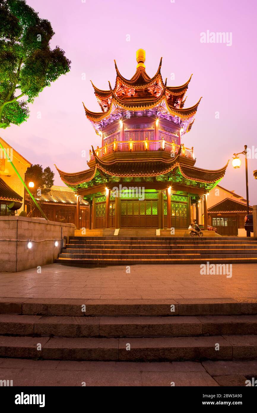 Suzhou, Jiangsu Province, China - Illuminated Pagoda in the old town at dusk. Stock Photo