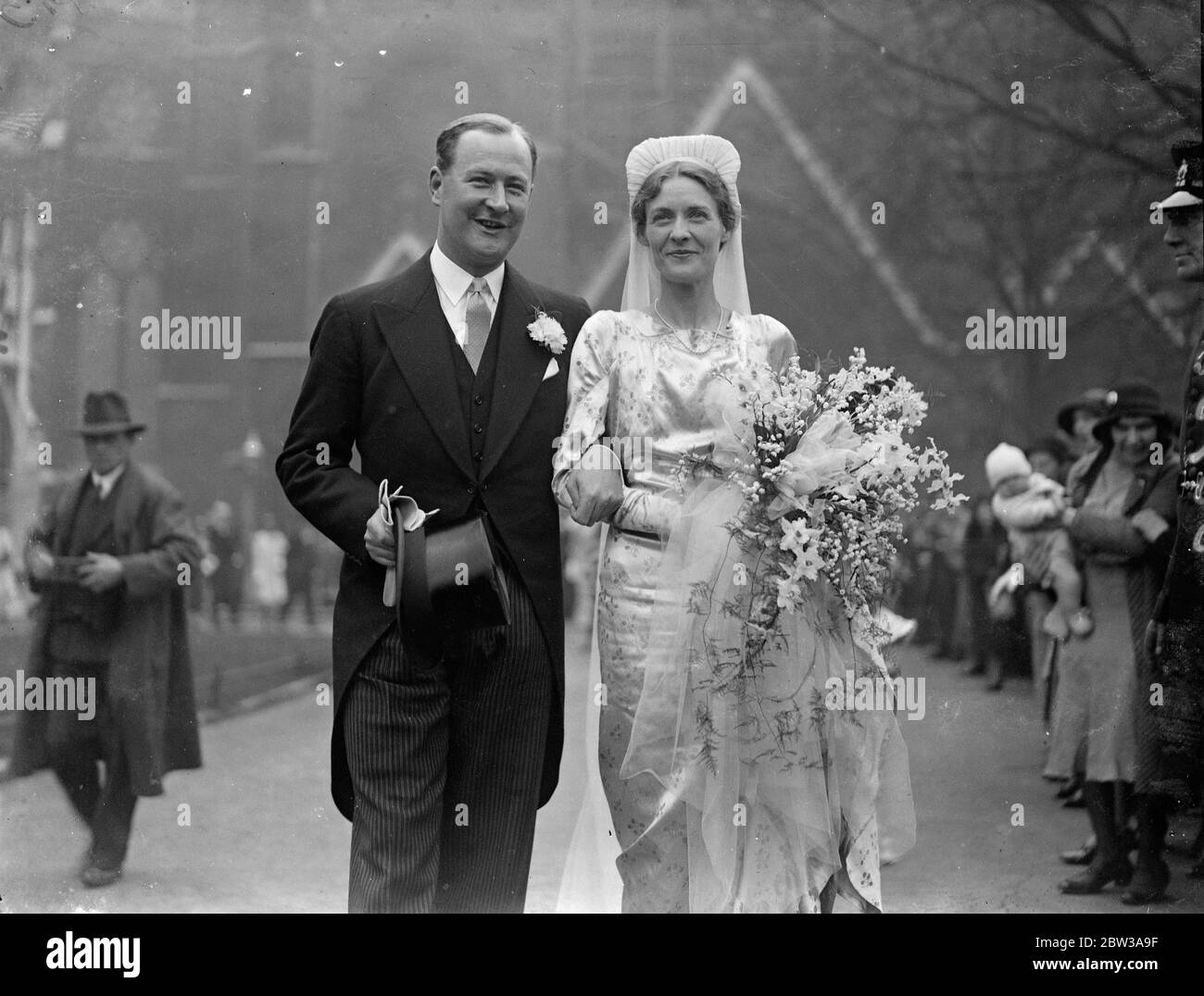 Miss Barbara Waterfield married to Mr Adam Morris at St Margaret ' s , Westminster . Miss Barbara Waterfield , daughter of Colonel and Mrs Waterfielld of Attlebridge , Norwich was married to Mr Adam Denzil Morris at St Margaret ' s Church , Westminster . Two four year old children were among the bridal attendants . They were Judy Miller and Michael Cripps . the latter is a grandson of Sir Frederick Gripps and a great grandson of Lord Vestey . The bridegroom is a son of Sir William Morris , formerly Governor of the United Provinces and Assam and now Vice Chancellor of Durham University . Photo Stock Photo