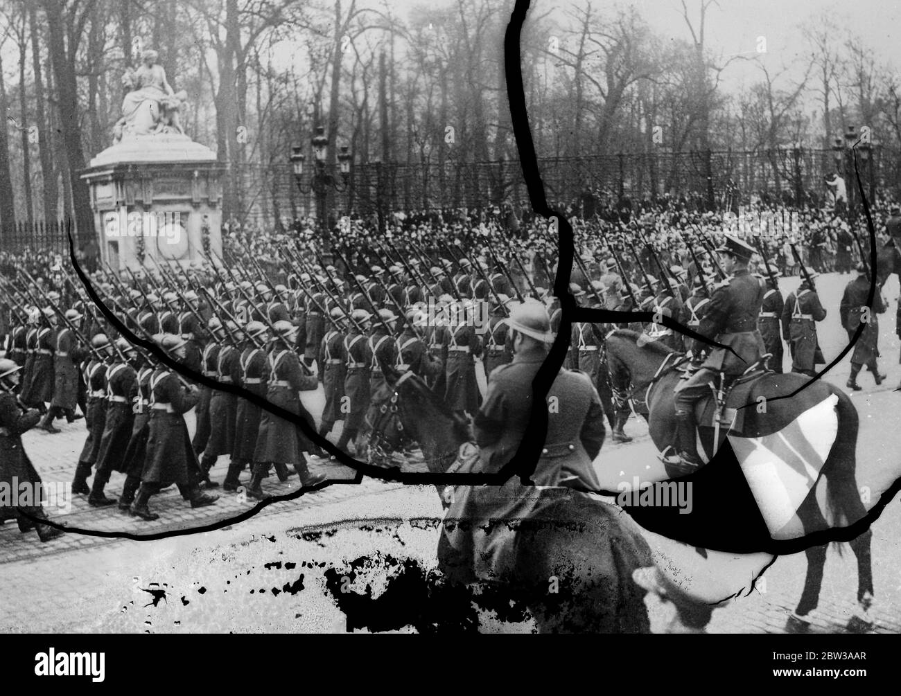 King Leopold reviews Brussels garrison for the first time . For the