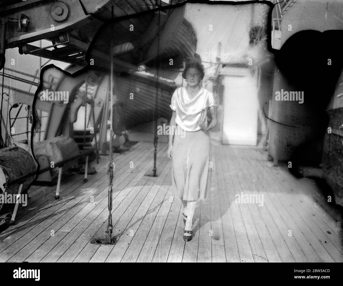 Miss Joyce Cooper , British Olympic swimming champion walking on deck on board ship . 11 May 1934 Stock Photo