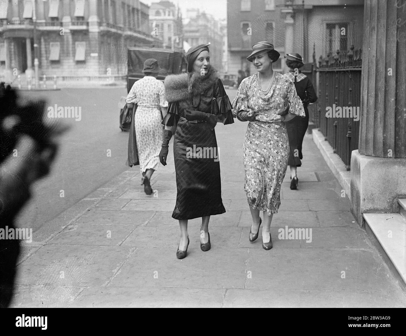 Mussolini 's daughter guest of Italian Embassy in London . The Countess Ciano , daughter of Signor Mussolini , the Italian dictator , is on a visit to London , and is staying as a guest of the Italian Embassy . The Countess Ciano leaving the Italian Embassy with Signora Grandi . 15 June 1934 Stock Photo