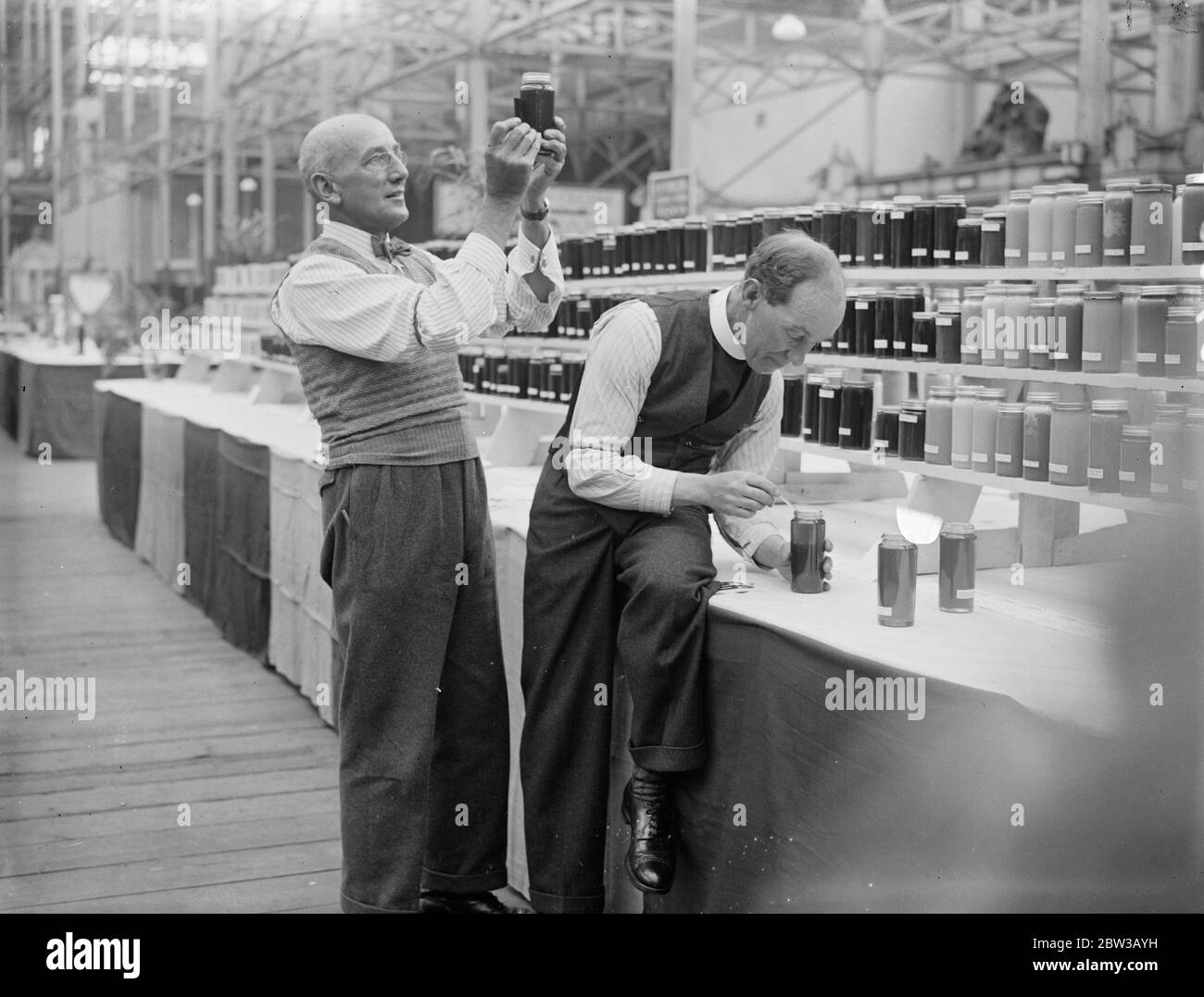 Judging honey at Crystal Palace show . 1934 Stock Photo Alamy