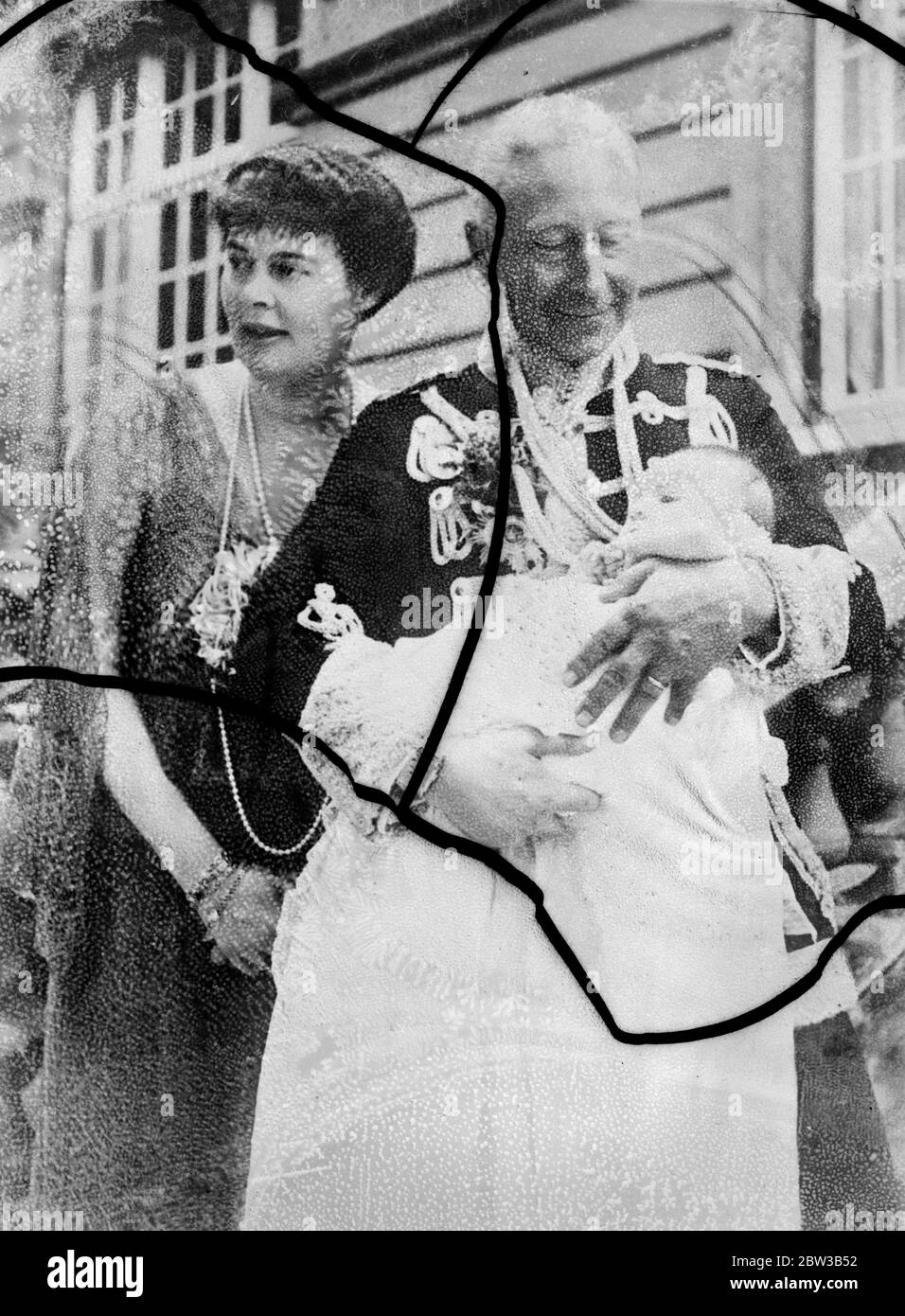 Ex - Crown Prince Wilhelm of Germany nursing his grandson . 5 October 1934 . Stock Photo