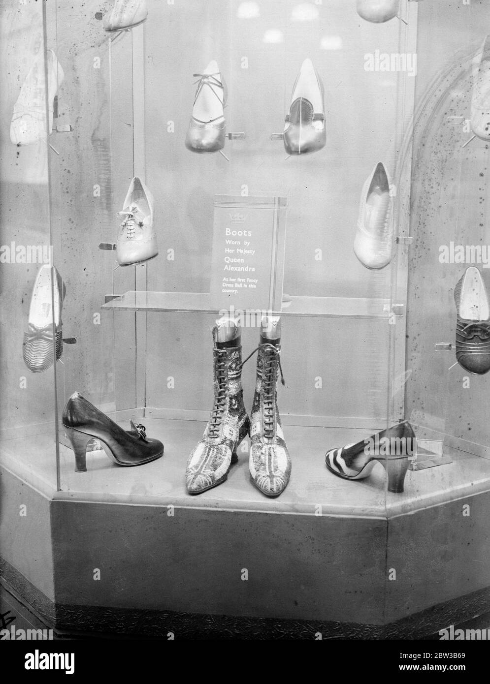 Boots worn by Queen Alexandra at a fancy dress ball , on show at a fair . 8 October 1934 . Stock Photo