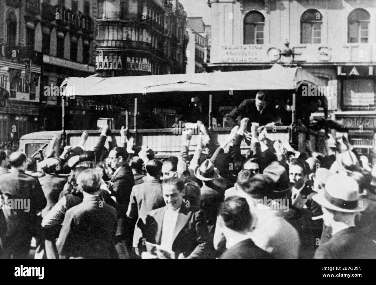 Stikers fighting for copy of newspaper issued by Government during strike in Spain . 10 October 1934 . Stock Photo