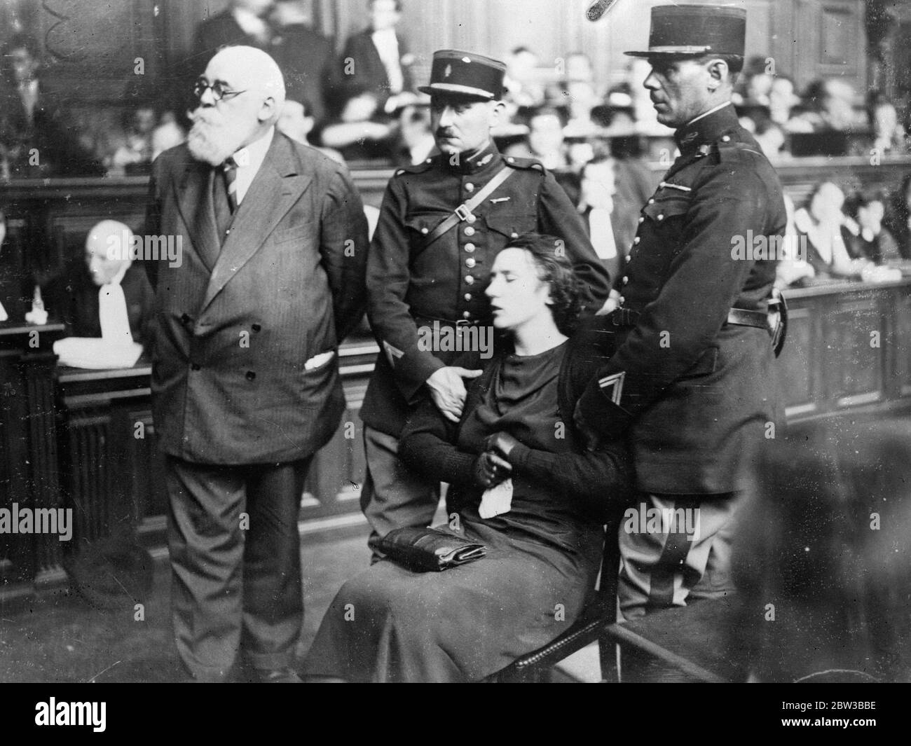 Violette Nozieres , a 19 year old French night club girl , fainted in the dock when charged with the murder of her father . 11 October 1934 . Stock Photo