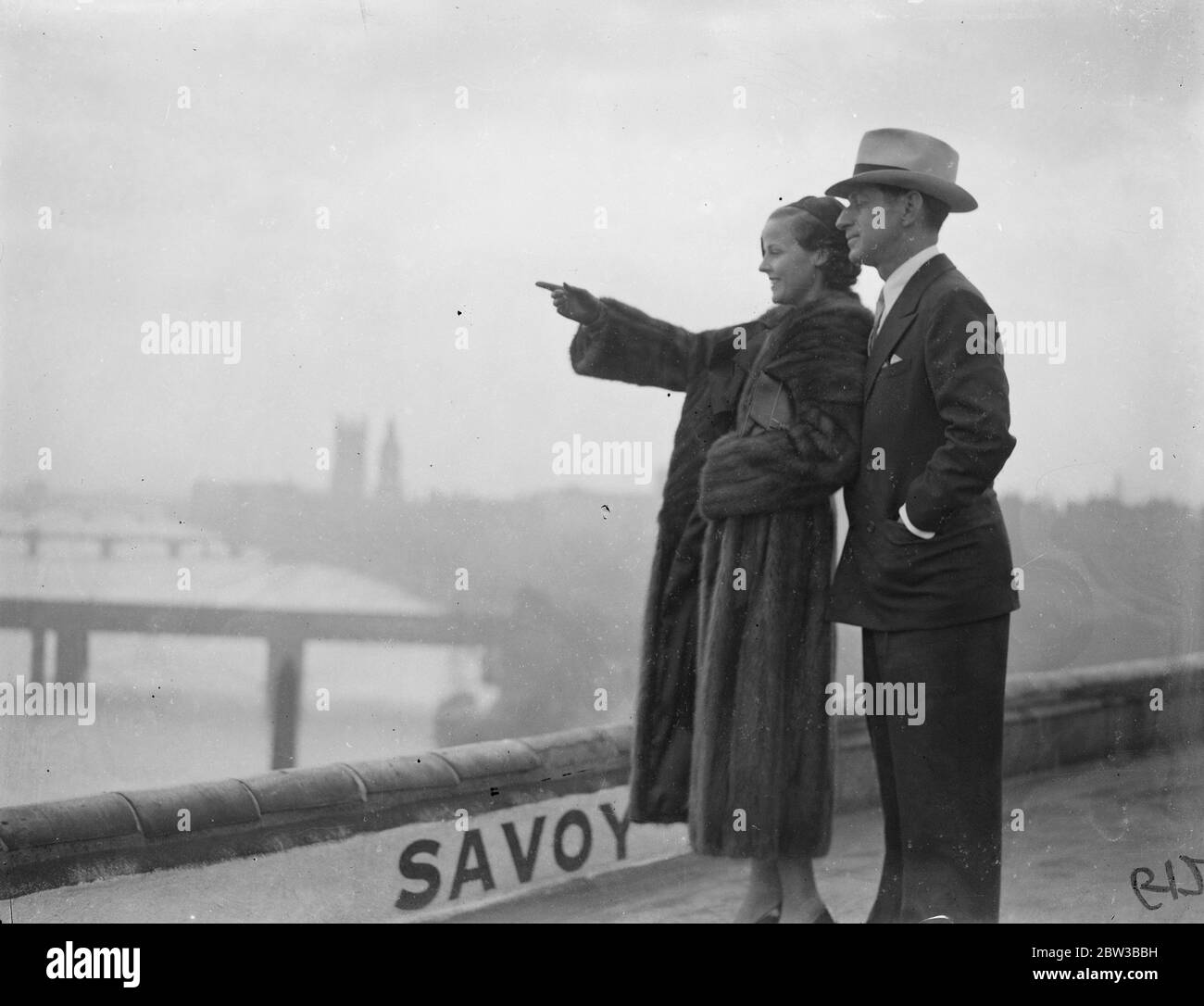 Barbara Kent , the film star , and Harry Edington , the Hollywood business agent , arrive in London . 12 October 1934 Stock Photo
