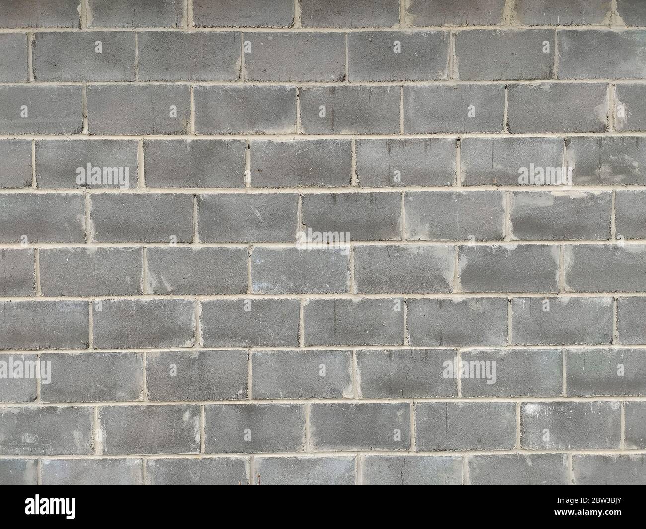 Texture of a strong gray wall of concrete blocks. Background. Copy ...
