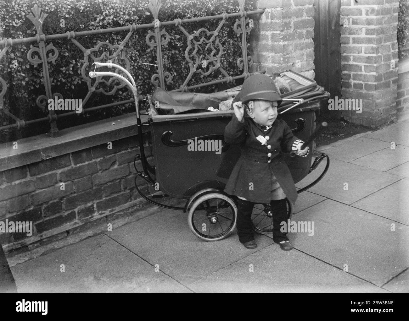 Baby Eyles , a Southend policeman 's son , in uniform . Studies of a baby . 23 October 1934 Stock Photo