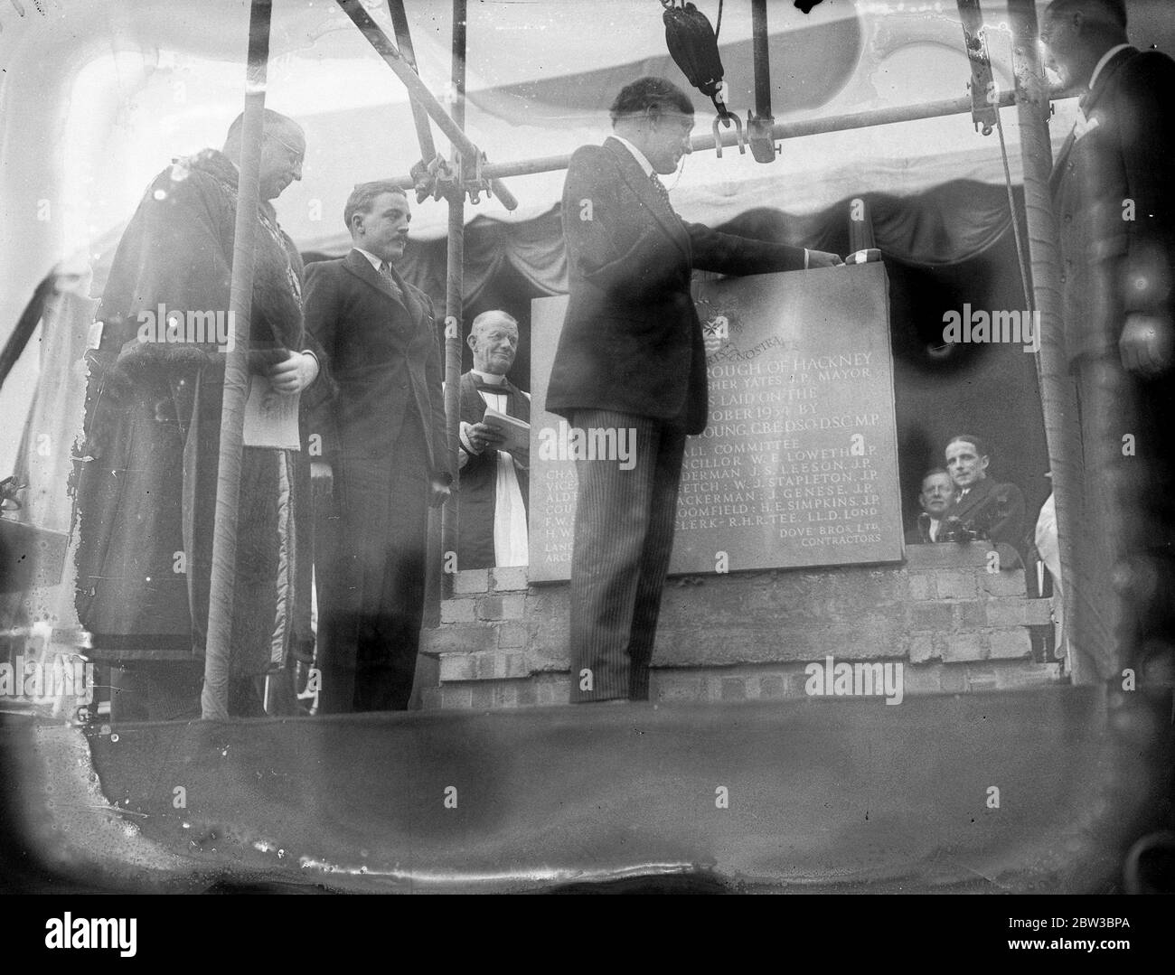 Minister of Health , Sir Hilton Young , lays the foundation stone of Hackney ' s new Town Hall . 22 October 1934 Stock Photo