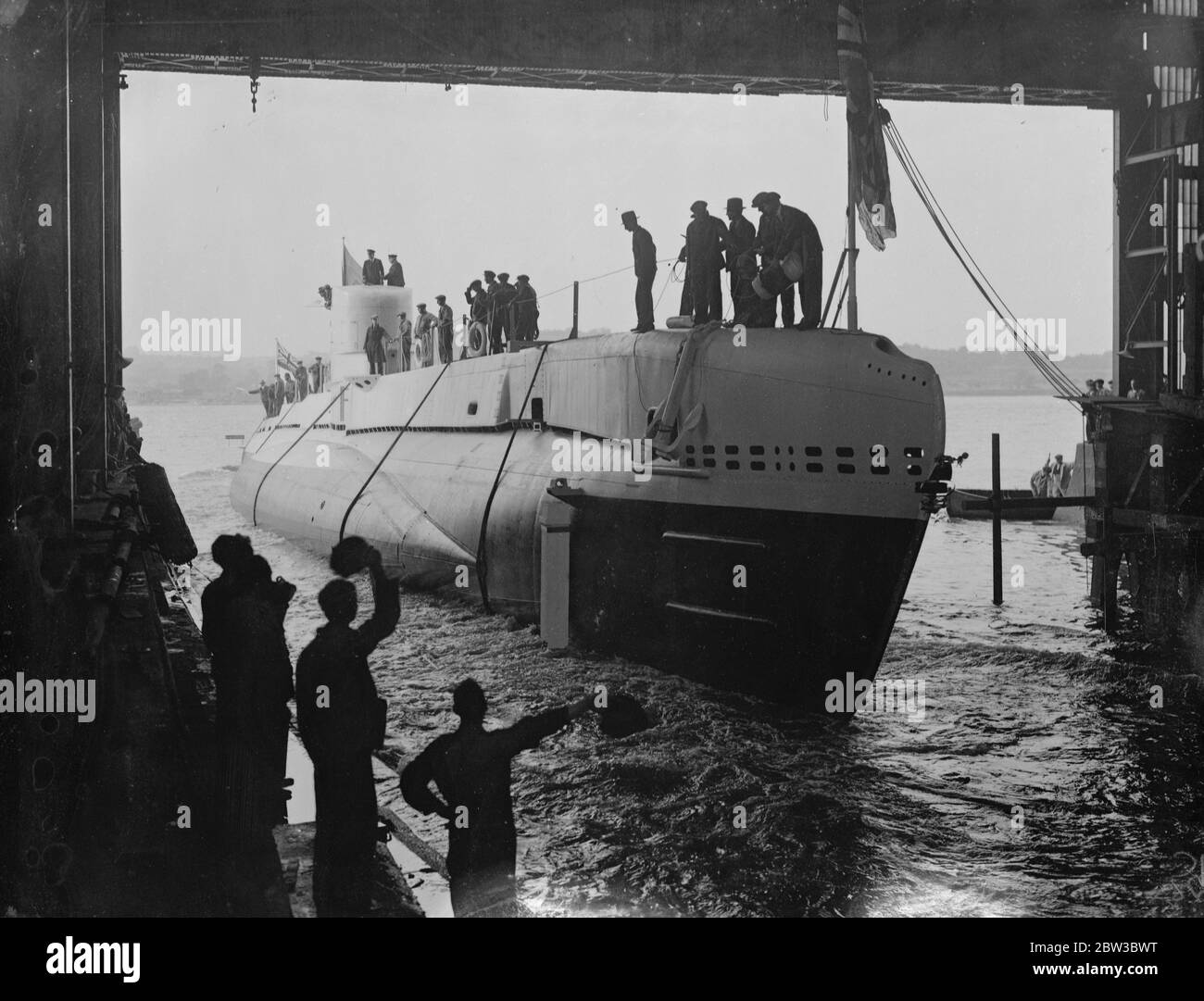 HMS Snapper , the new Royal Navy S-class submarine , was launched at Chatham Dockyard , Kent . The naming ceremony was performed by Lady Tweedie , the wife of Vice-Admiral Sir Hugh J Tweedie who is the Commander-in-Chief of the Nore . Photo shows the new submarine taking the water at her launch October 25th 1934 . Stock Photo