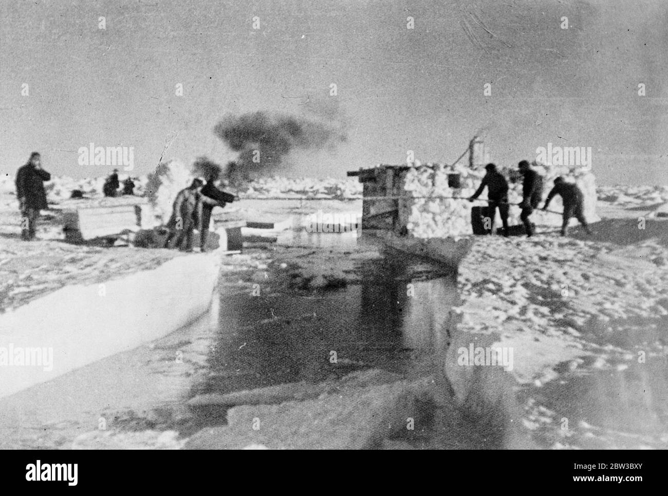 SS Chelyuskin , a Soviet steamship sent out on an expedition to navigate through polar ice along the Northern Maritime Route from Murmansk to Vladivostok , has became ice-bound in Arctic waters during navigation . It was caught in the ice fields in September. After that it drifted in the ice pack before sinking on February 13 , 1934, crushed by the icepacks near Kolyuchin Island in the Chukchi Sea . The crew managed to escape onto the ice and built a makeshift airstrip using only a few spades , ice shovels and two crowbars , which helped in the rescue of the crew . Fifty three men walked over Stock Photo