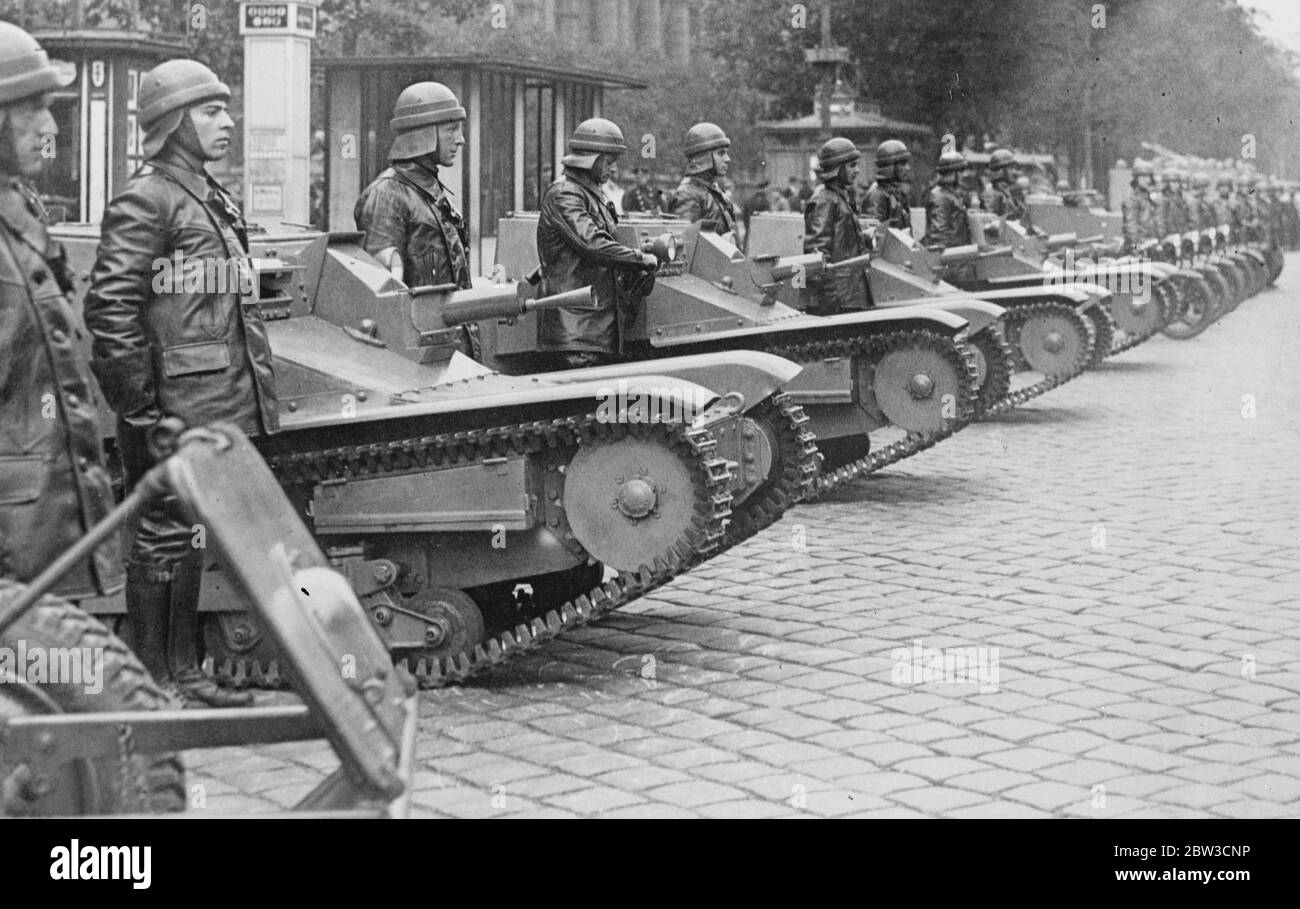 Austria displays her new tanks . Rulers watch parade of forbidden war machines at Vienna . Austria 's new light tank corps lined up for inspection . 28 October 1935 Stock Photo