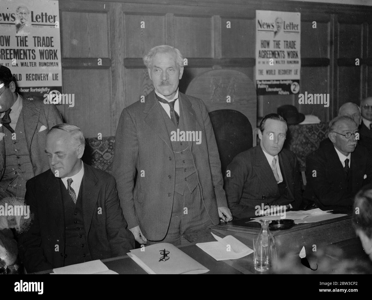 Mr Ramsay Macdonald addresses National Labour conference at Caxton Hall , London . Mr Ramsay Macdonald speaking . Also in the picture are Mr J H Thomas and Earl de la Warr . 28 October 1935 Stock Photo