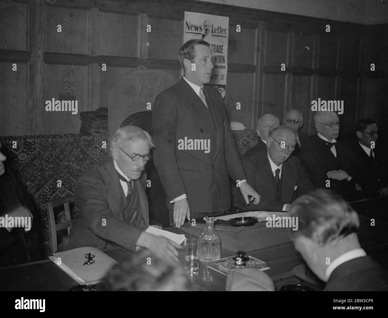 Earl de la Warr as chairman at National Labour conference at Caxton Hall , London . Earl de la Warr speaking . Also in the picture are Mr Ramsay Macdonald and Mr J H Thomas . 28 October 1935 Stock Photo