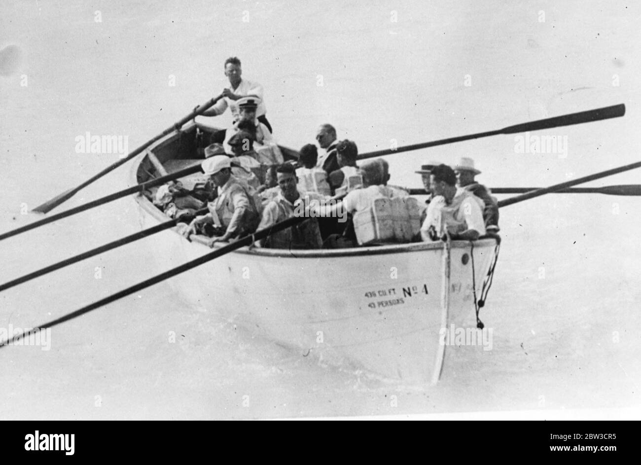 Hundreds of passengers rescued from liner as hurricane strikes Florida . Passengers of the Dixie in a lifeboat as they waited to be picked up . 14 September 1935 Stock Photo
