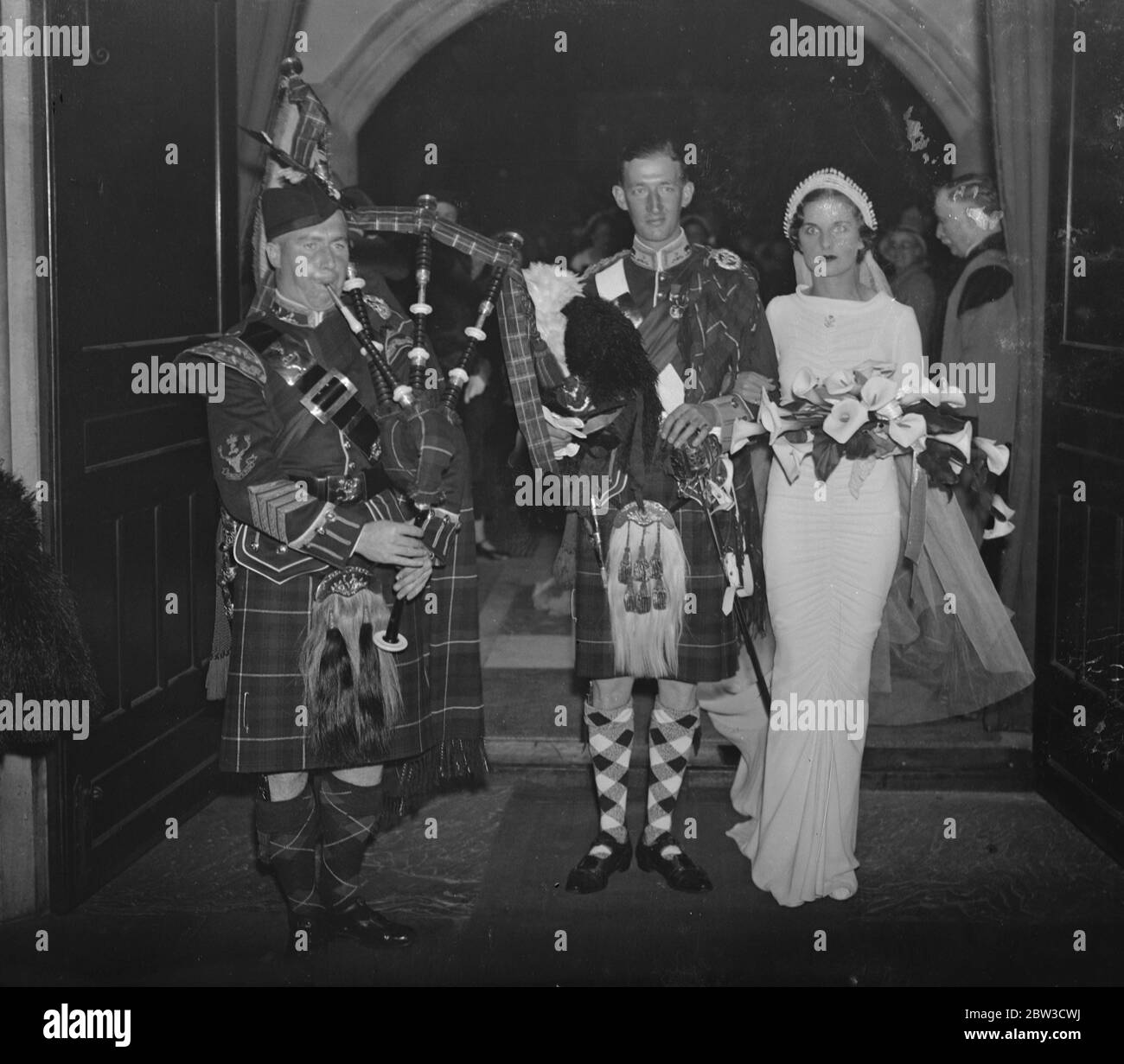 Seaforth Highlanders officers wed ' s generals daughter . Photo shows , Miss Joyce Kirk and Mr A J Holkett Cassels being piped from the church . 30 October 1935 Stock Photo