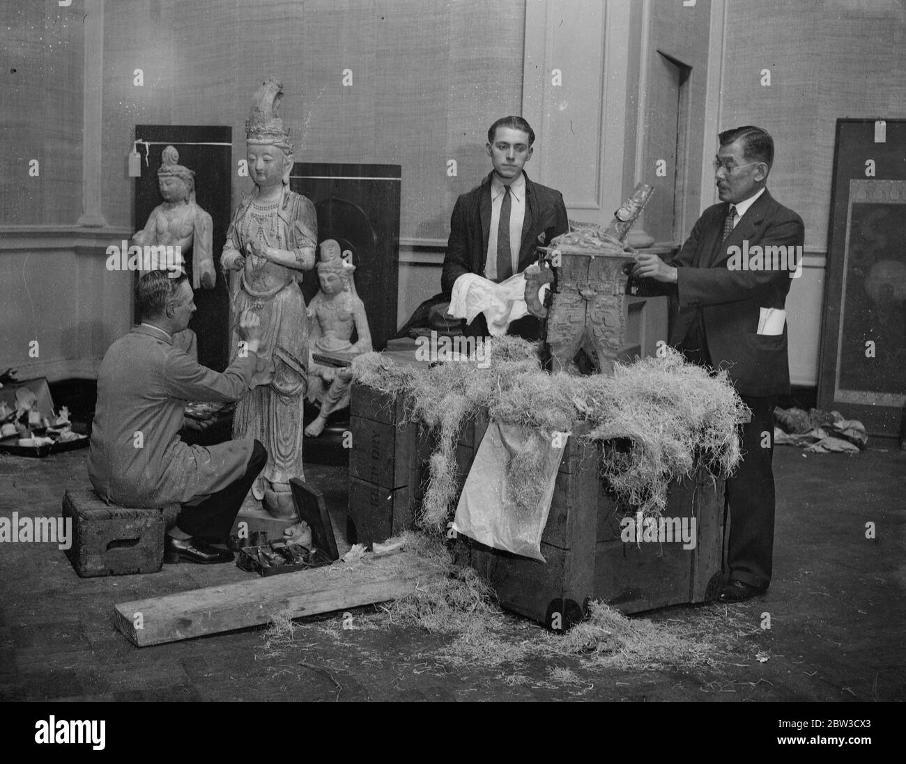 Emperor of Japan 's Chinese art treasures being unpacked in London for exhibition . Mr Somoji Okada , Commissioner for Chinese exhibits from Japan , superintending the unpacking of the pieces at Burlington House . 1 November 1935 Stock Photo